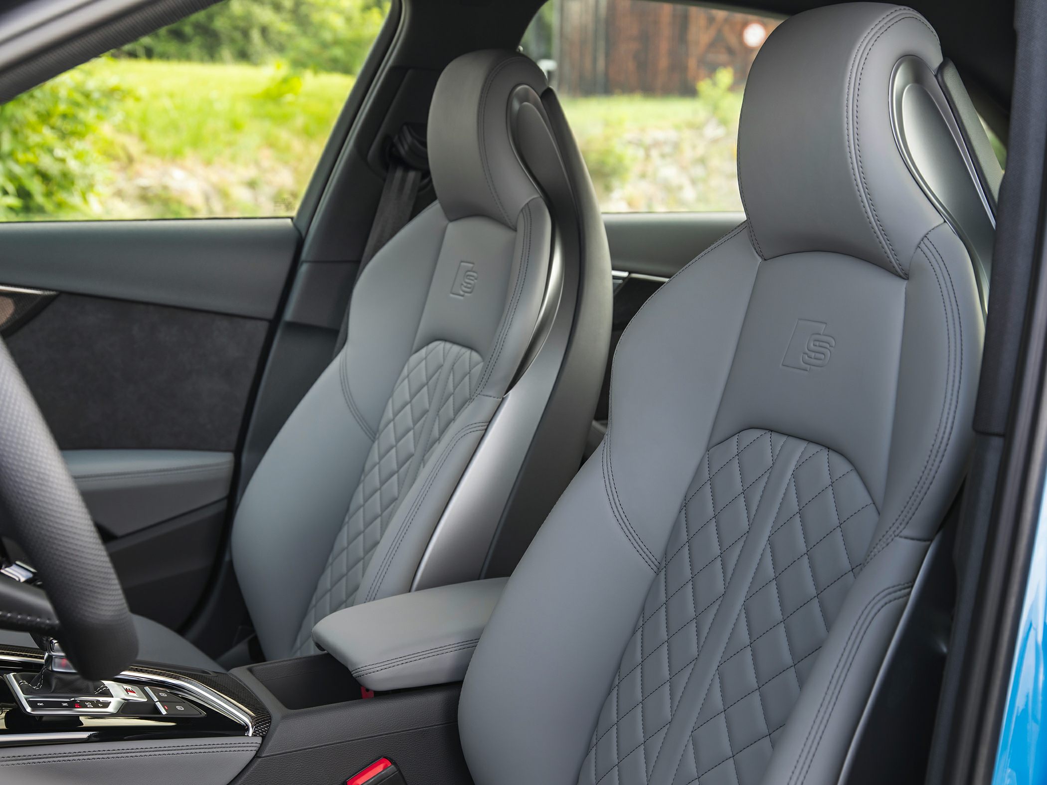 Luxury quilted leather sports seats with embossed logos