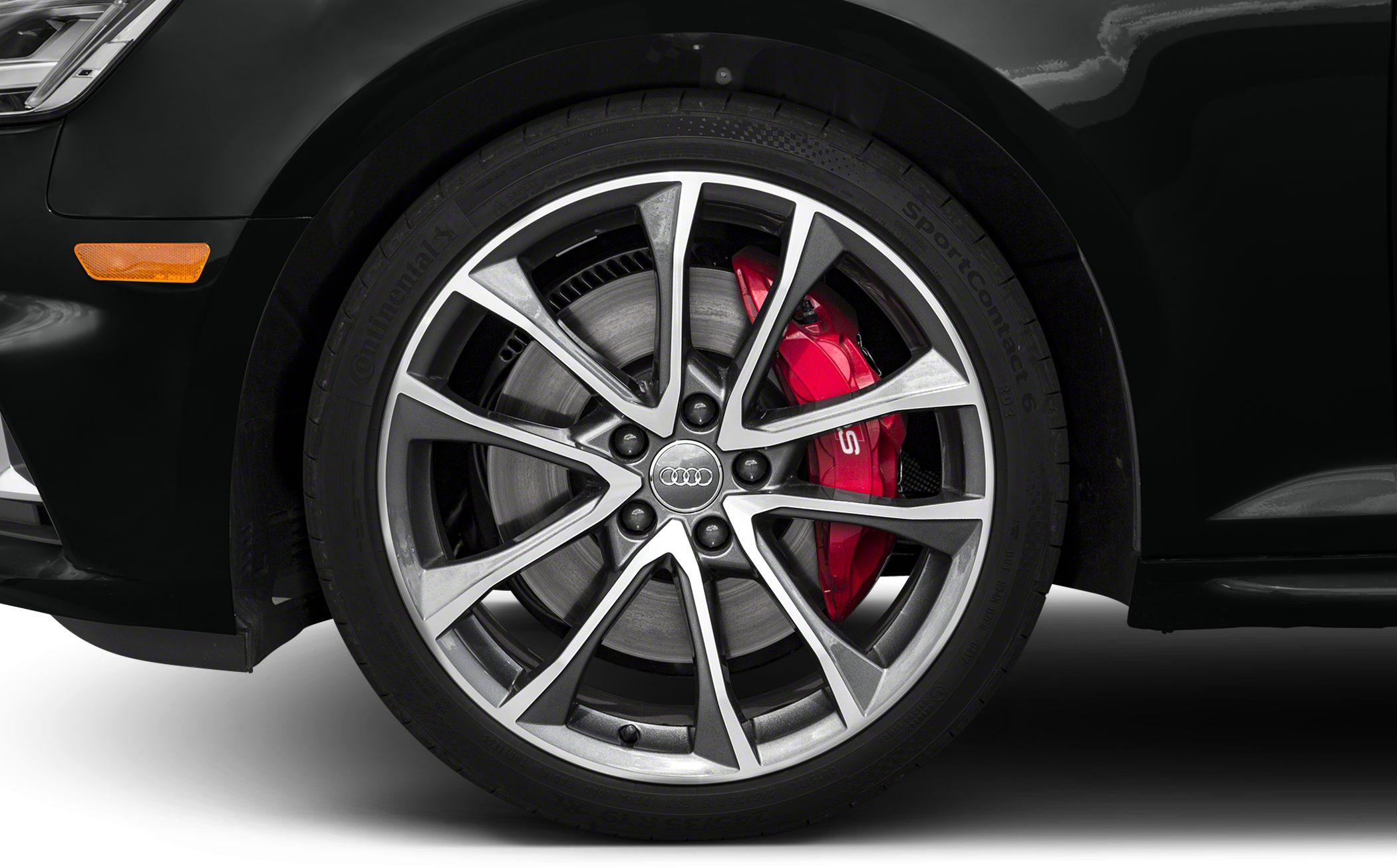 Multi-spoke alloy wheel with red brake caliper
