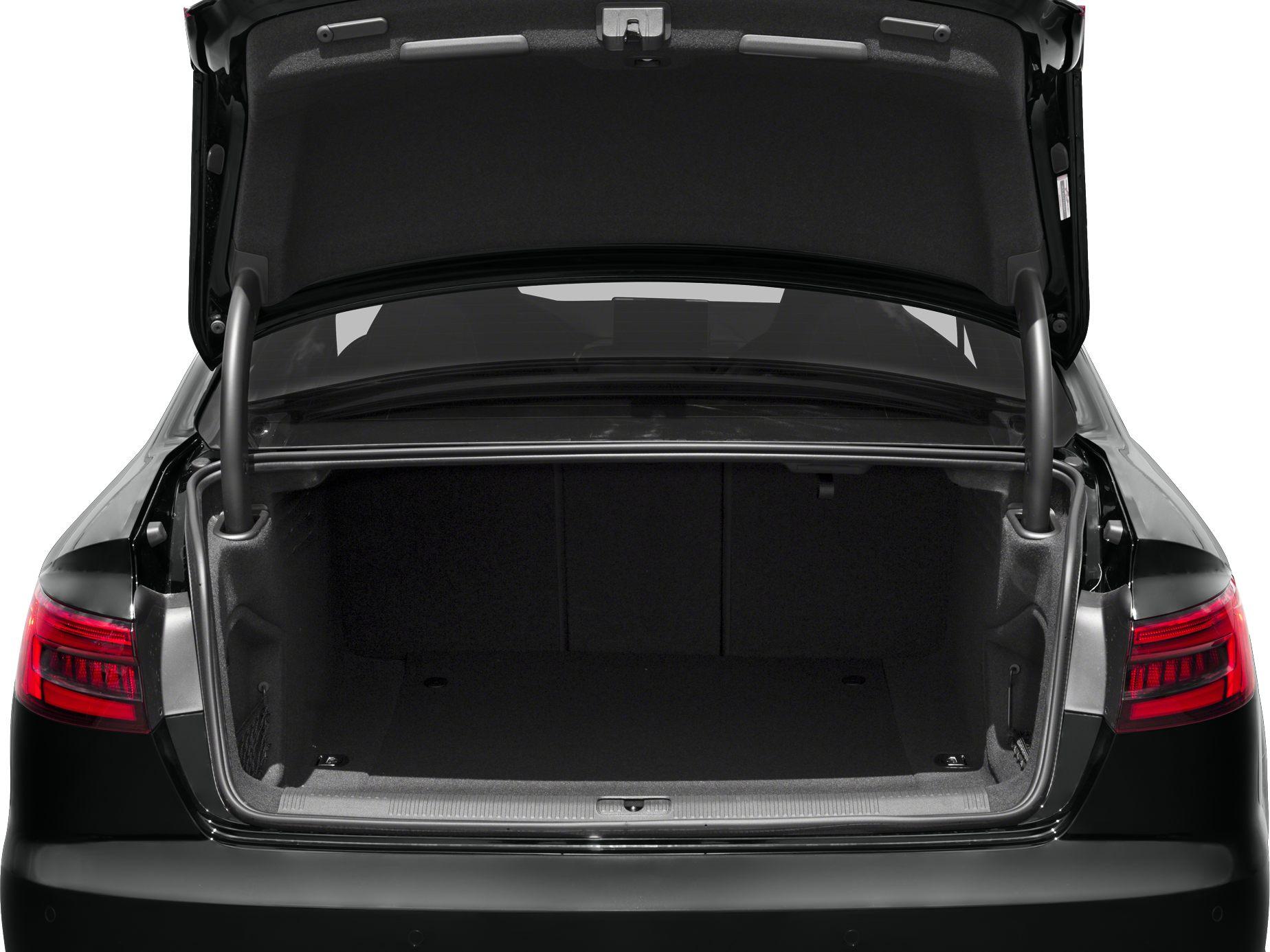 Open spacious trunk interior of a sedan with visible taillights.