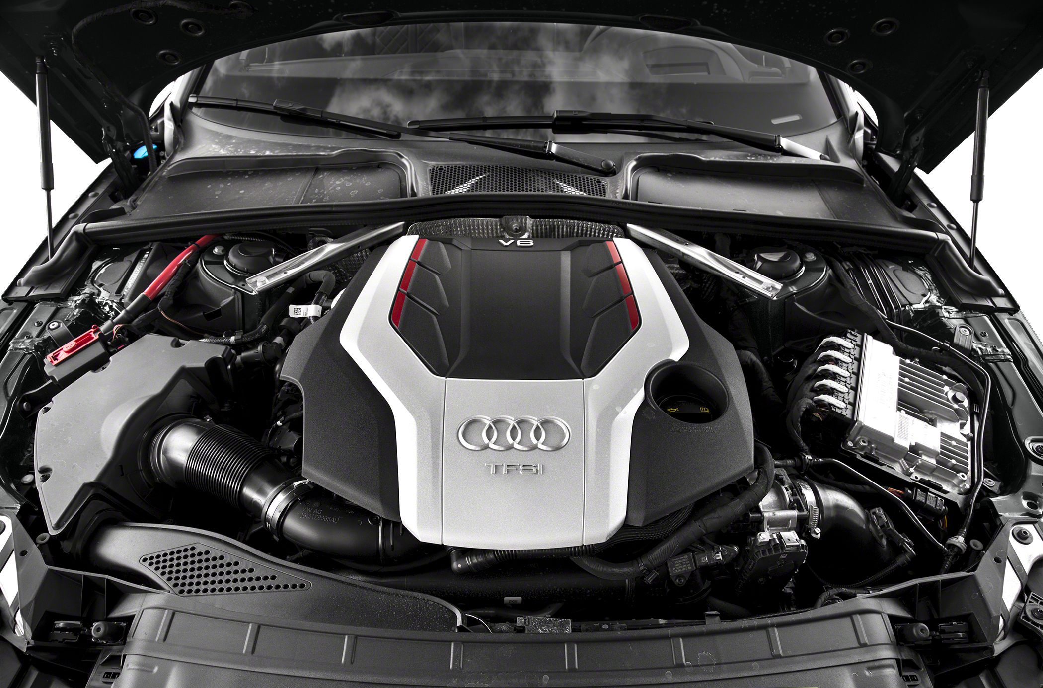 Close-up of a V6 TFSI engine with Audi four rings emblem and engine cover