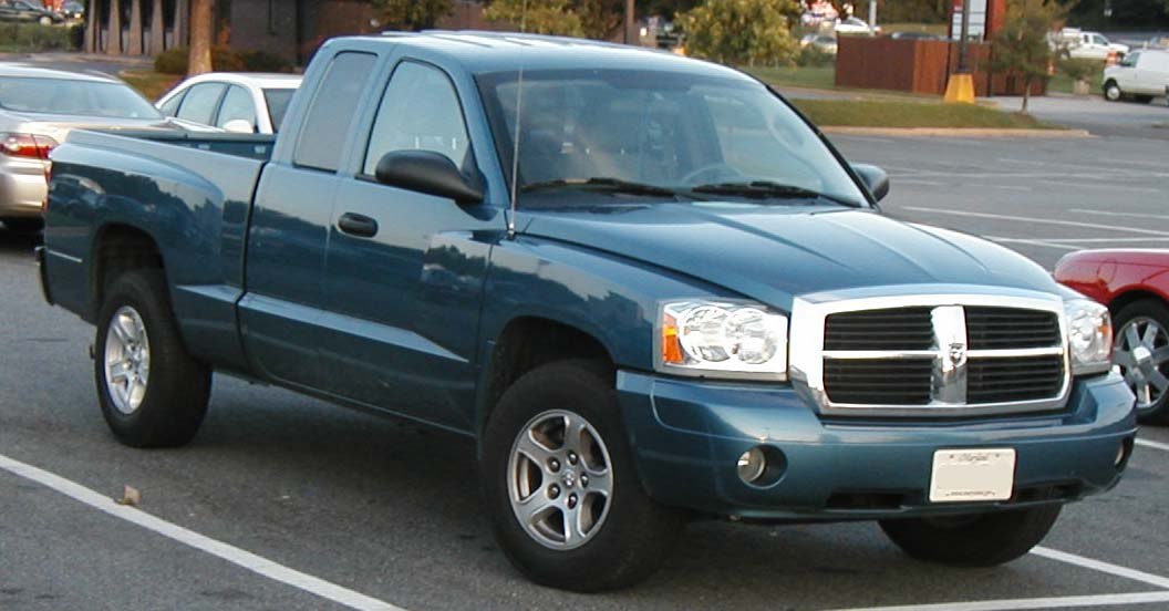 Pickup truck front side profile with extended cab and grille details