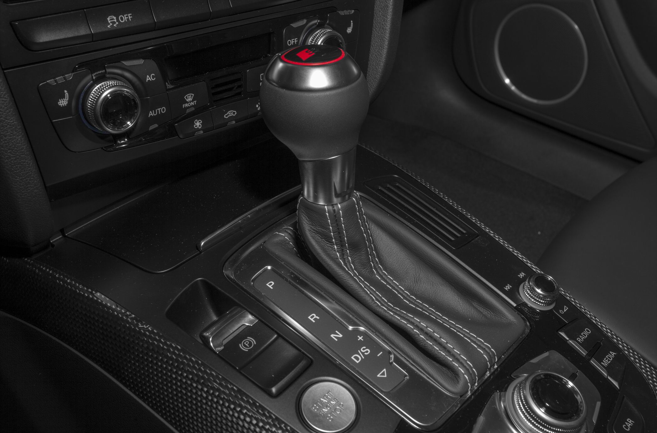 Close-up of gear shift lever and center console controls