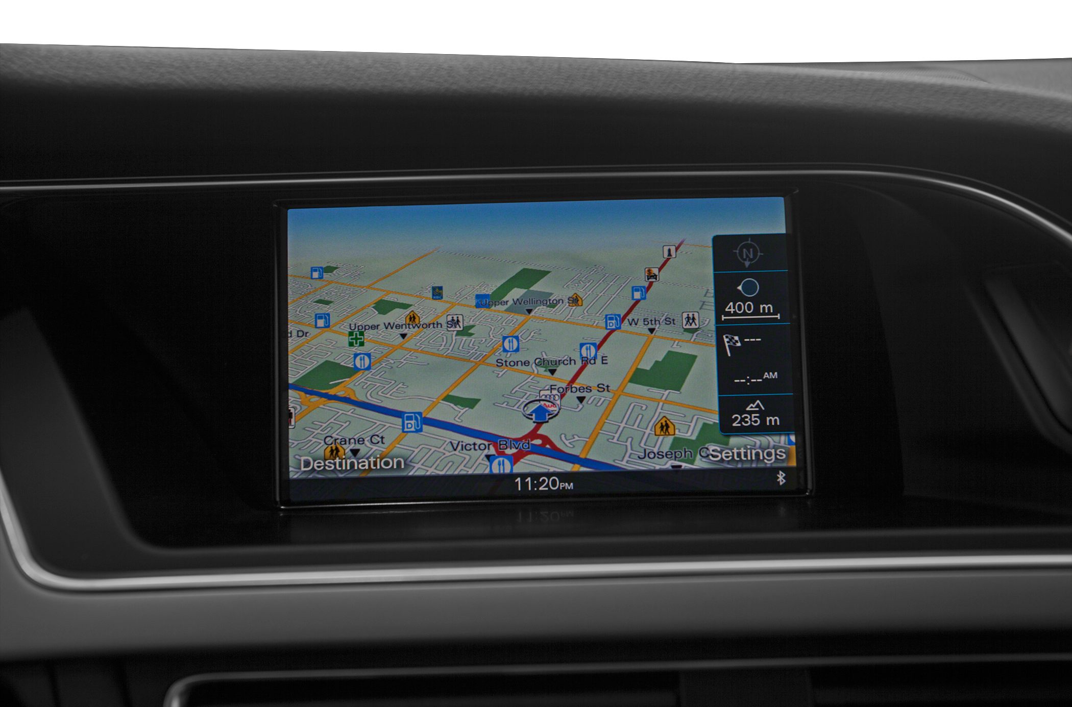 In-car digital navigation screen with detailed map and route guidance.
