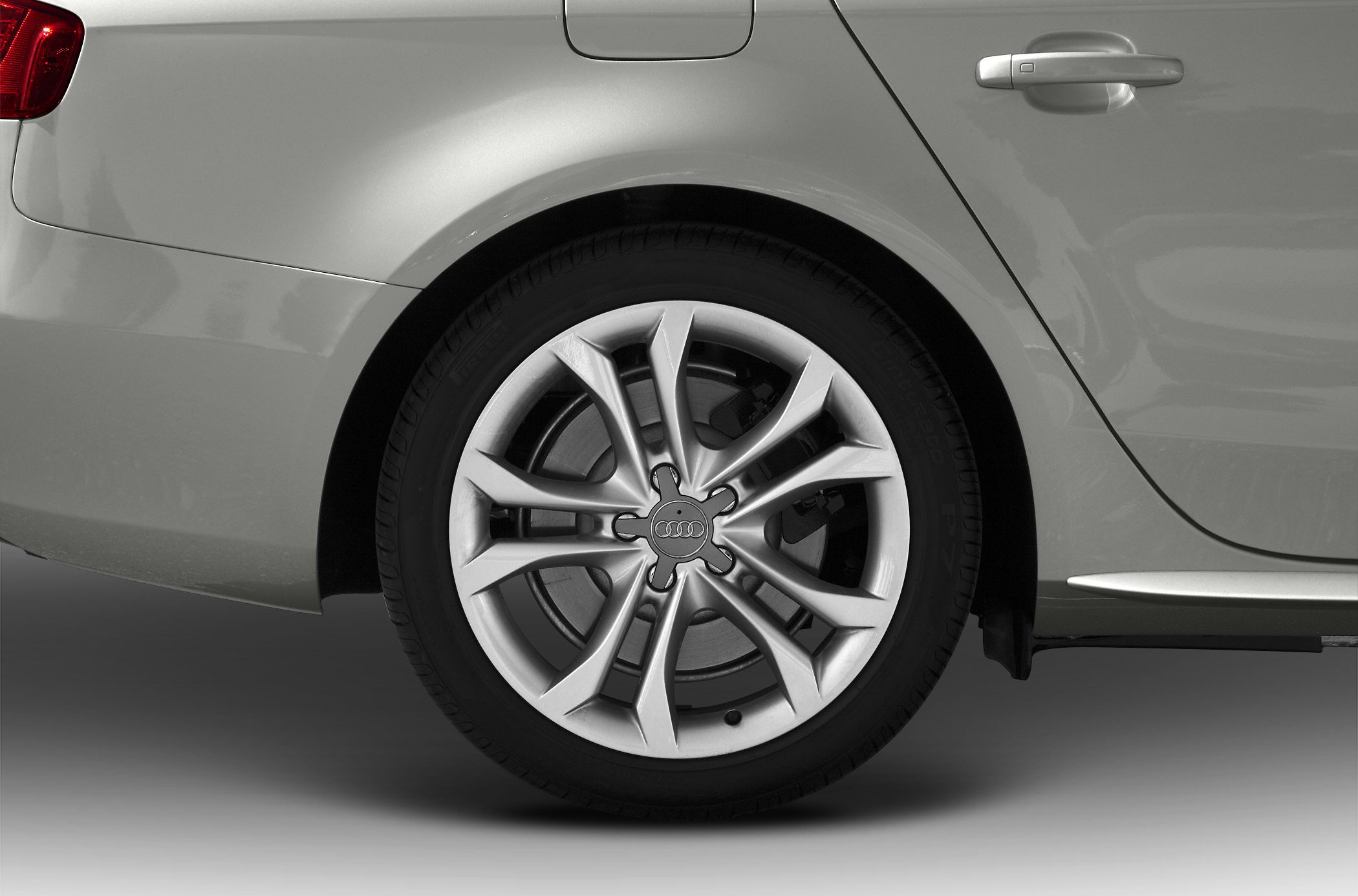Rear wheel with intricate alloy rim and visible brake disc