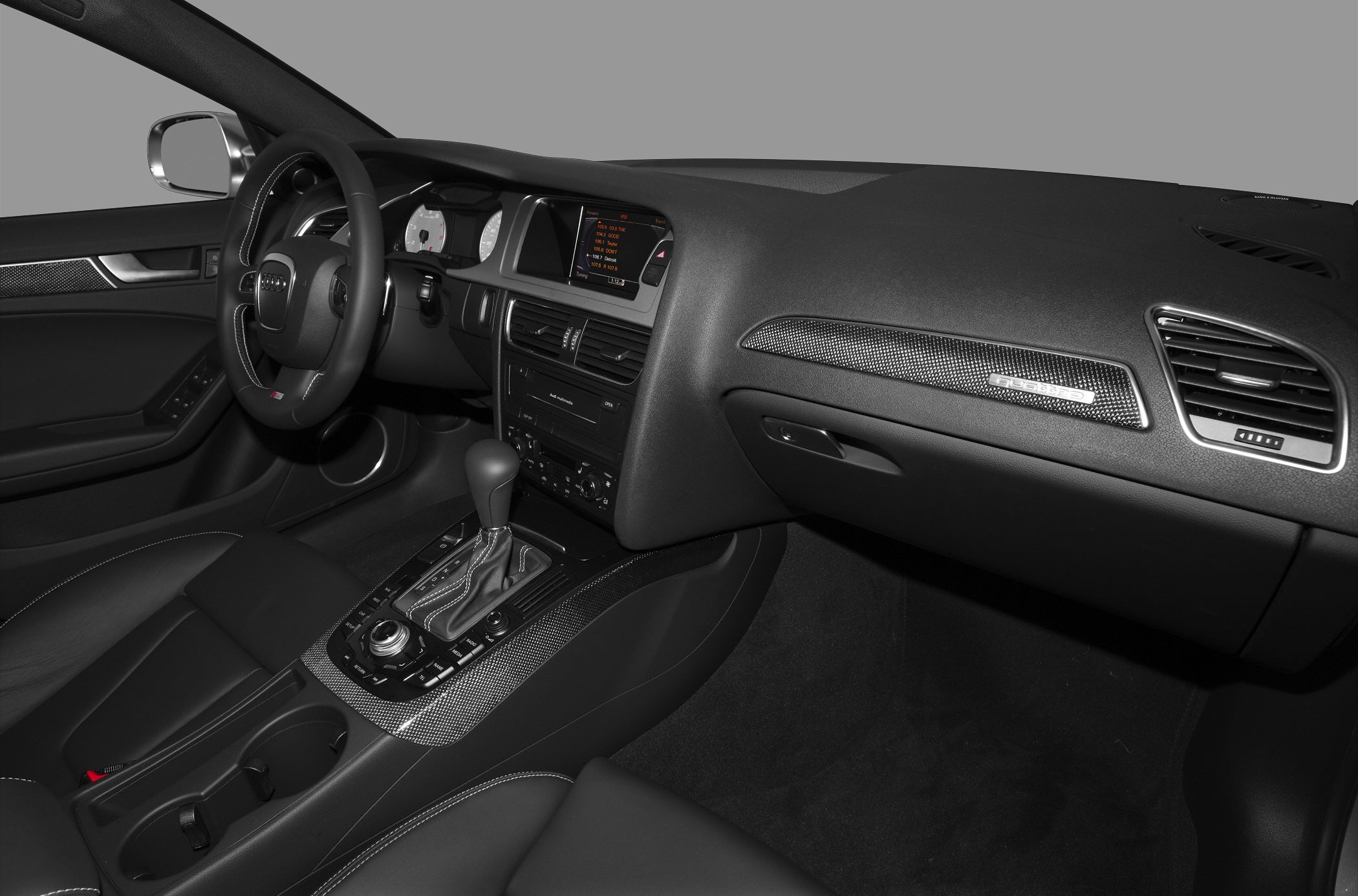 Car interior with automatic gear shift and MMI system
