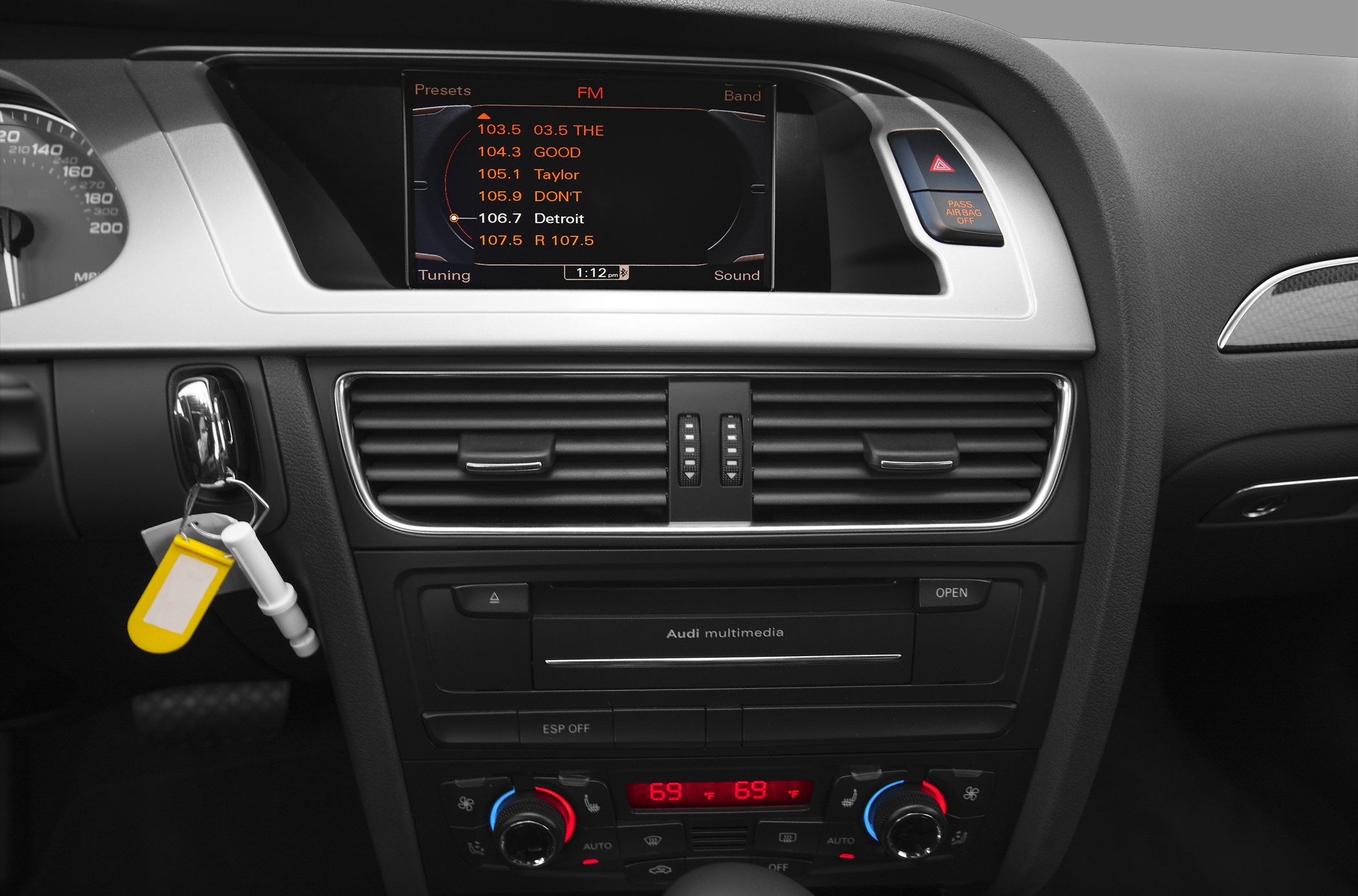 Car dashboard with multimedia display and dual-zone climate control