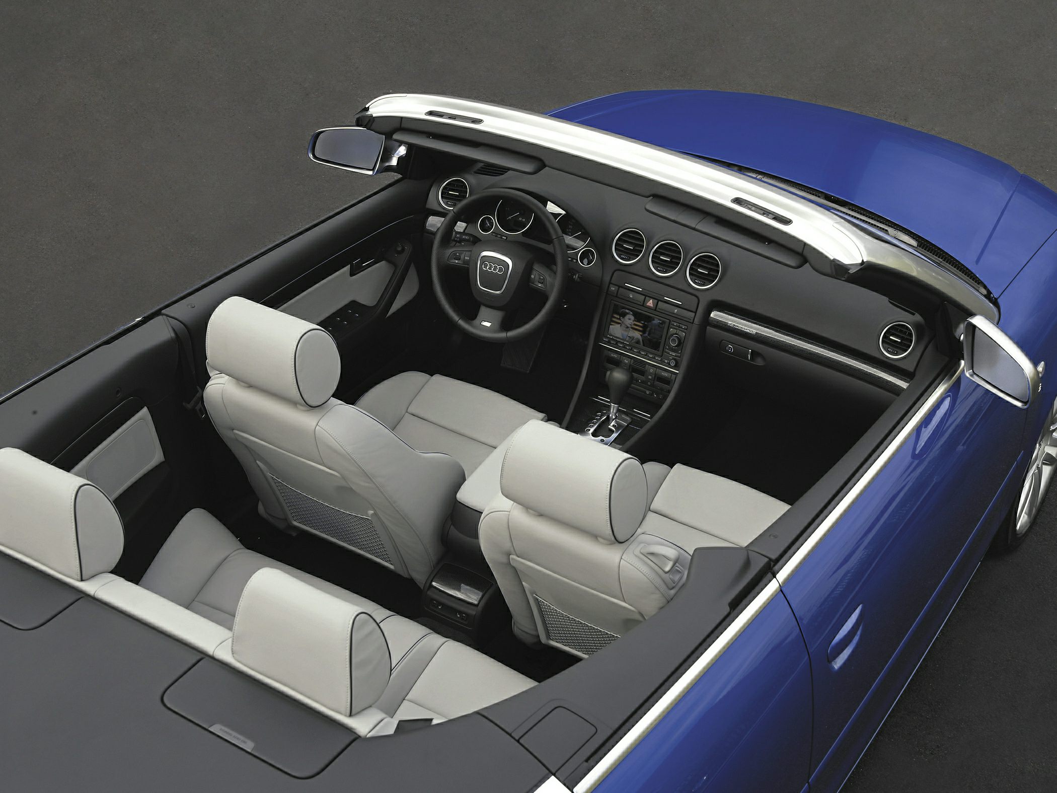Convertible interior with white leather seats and dashboard
