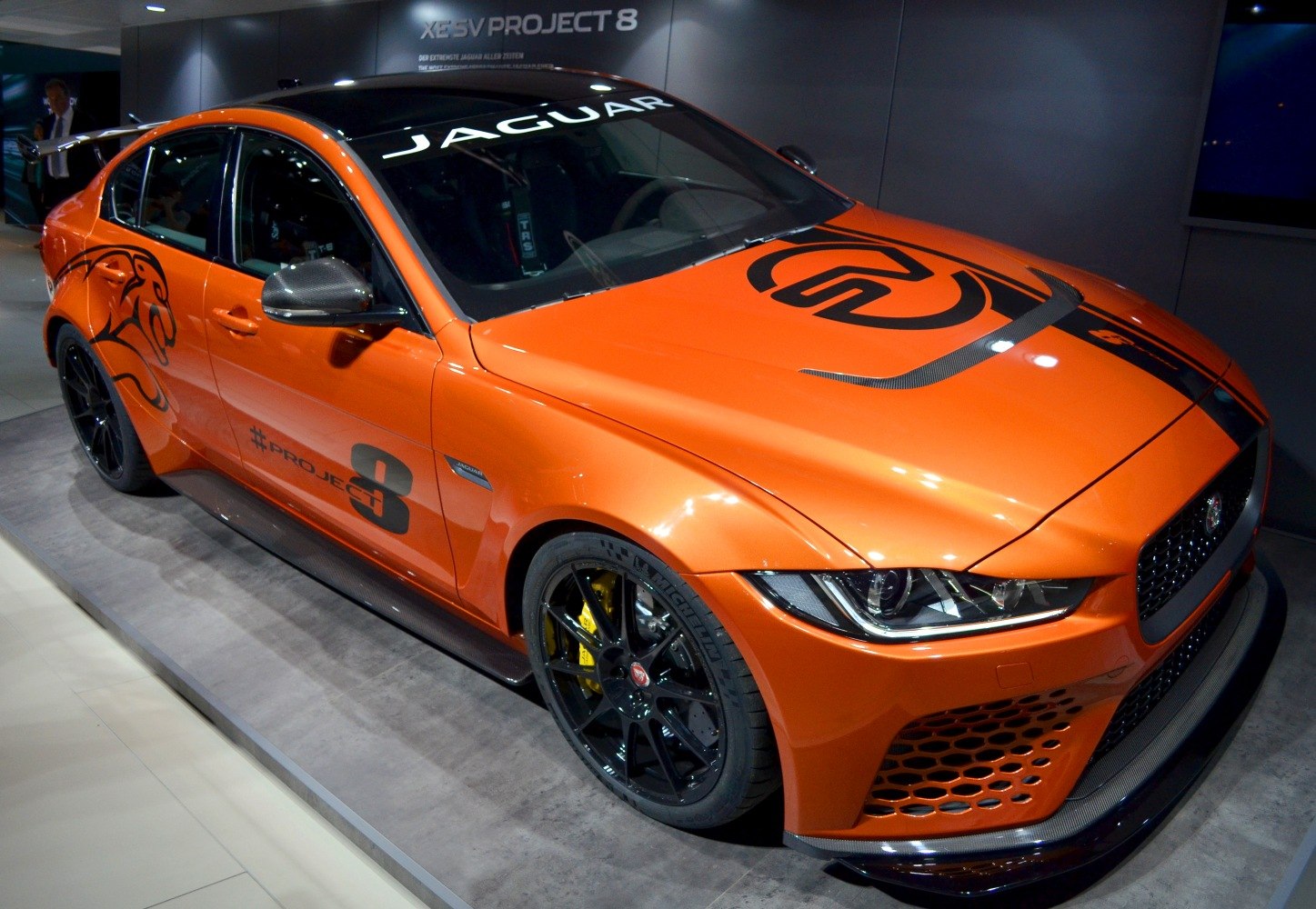 Race-tuned sedan with orange livery and aerodynamic features