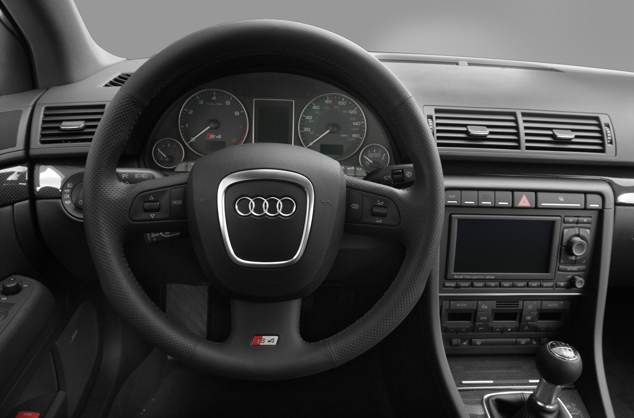 Steering wheel, dashboard gauges, and center console with gear shift
