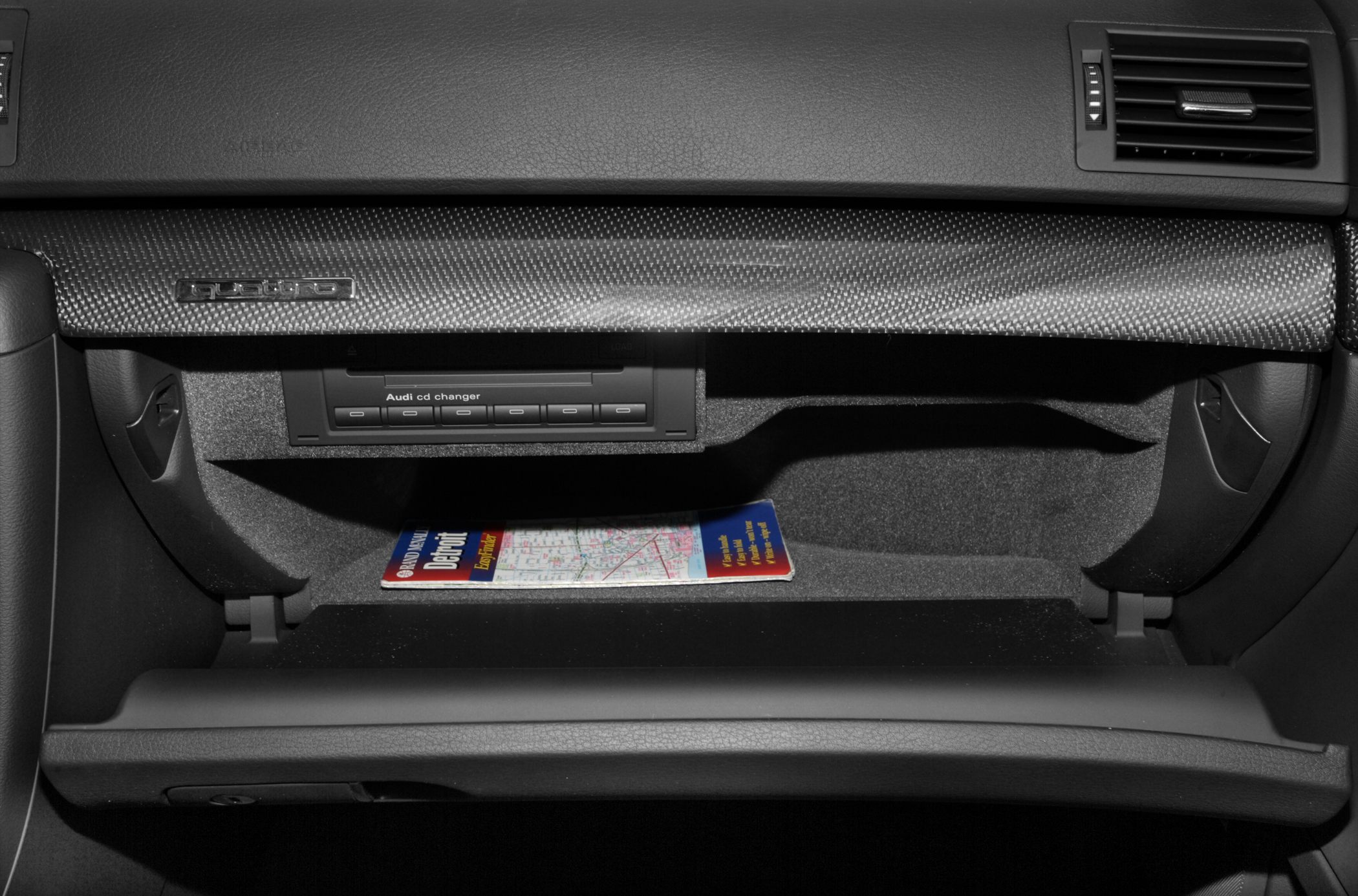 Glove box with carbon fiber trim and built-in CD changer