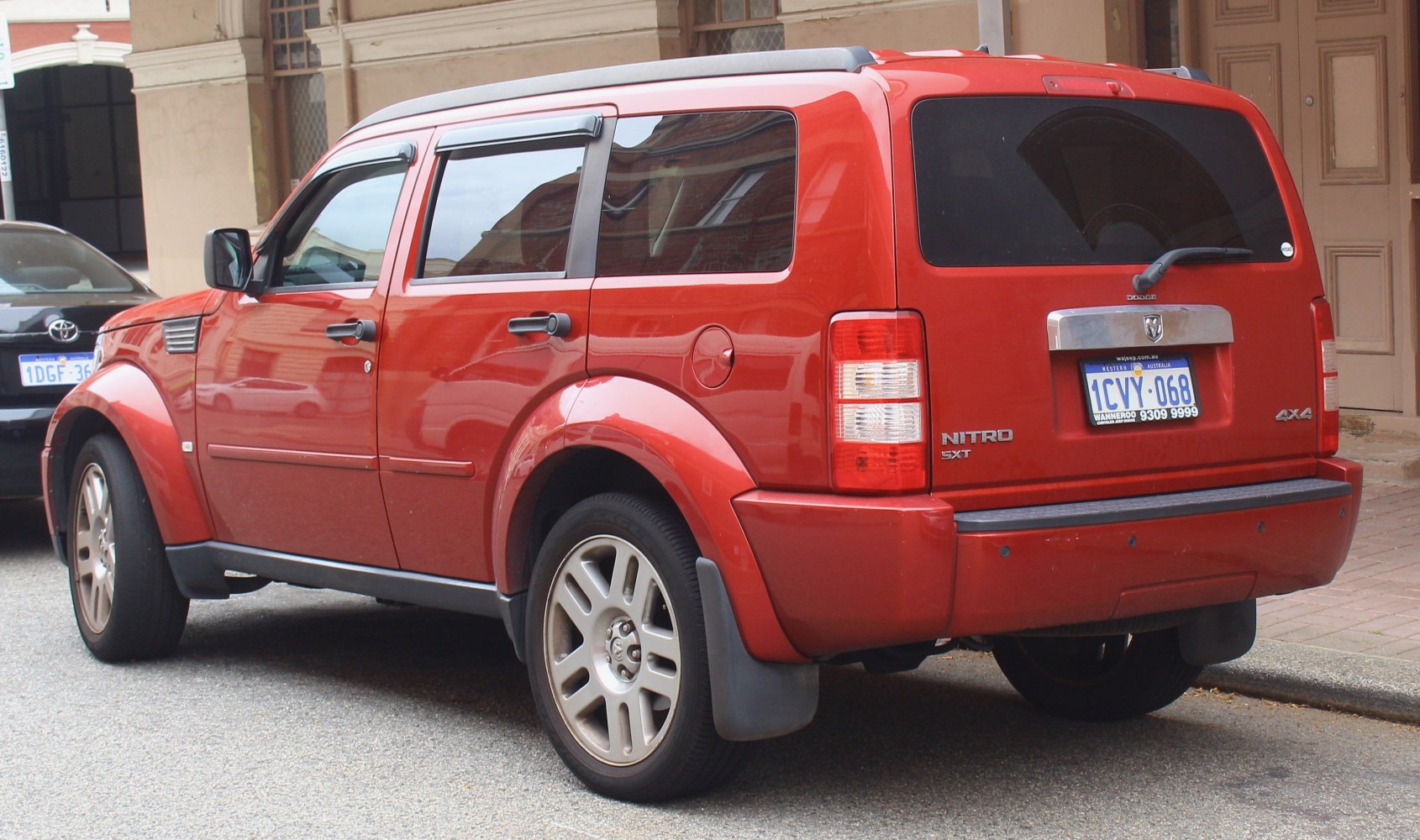 Boxy SUV rear side with tinted windows and 4x4 badge