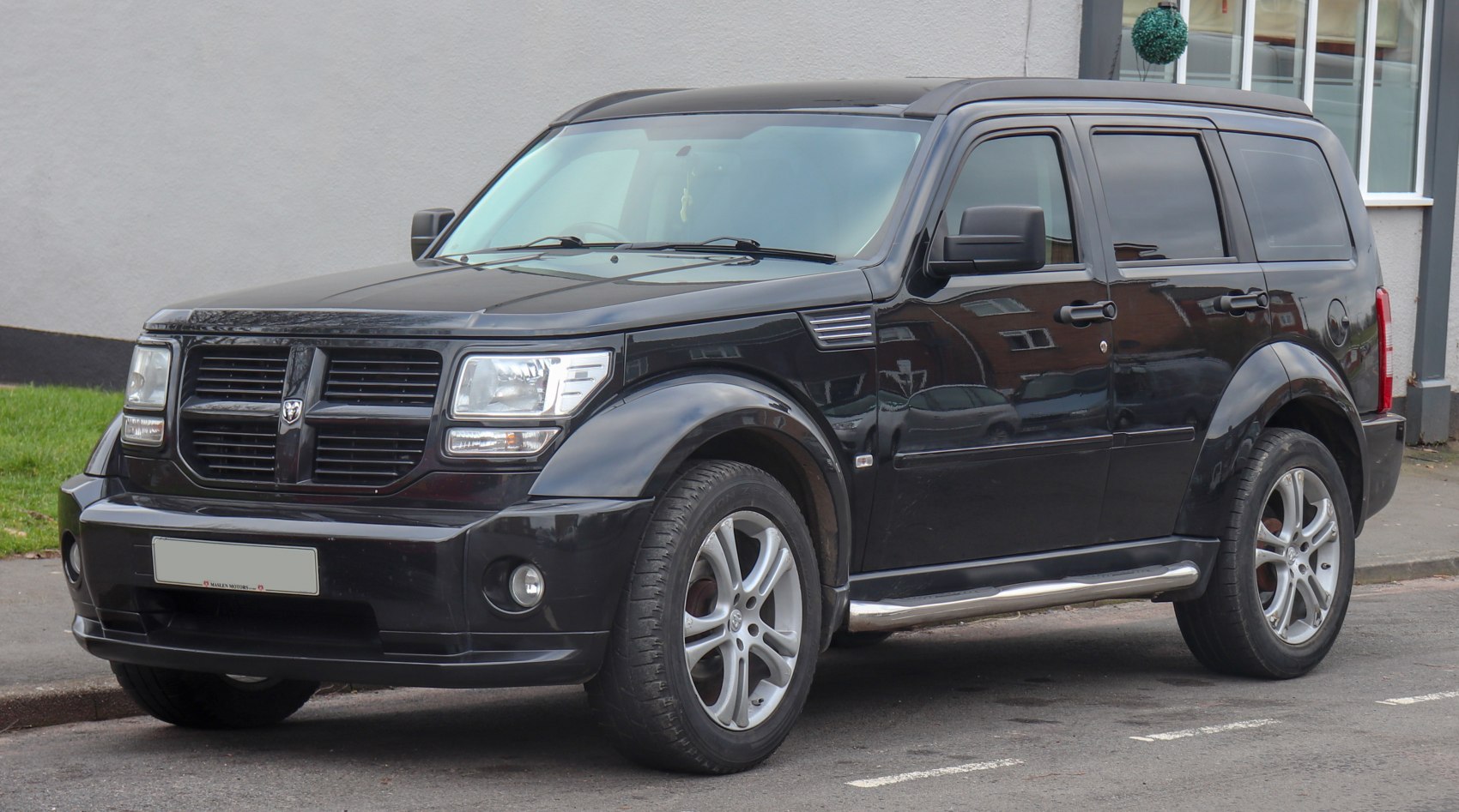 SUV front side view with signature grille and alloy wheels