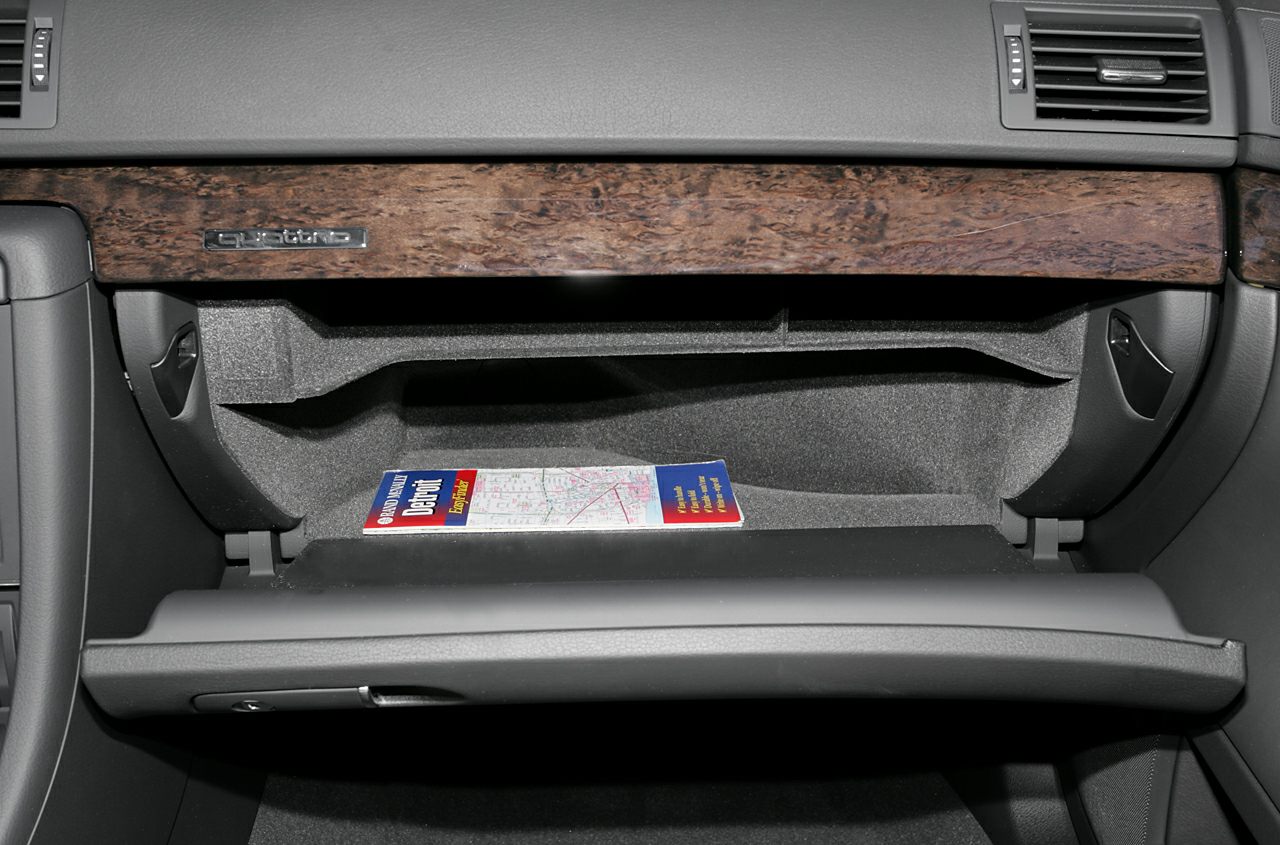 Glovebox compartment with wood trim and quattro emblem