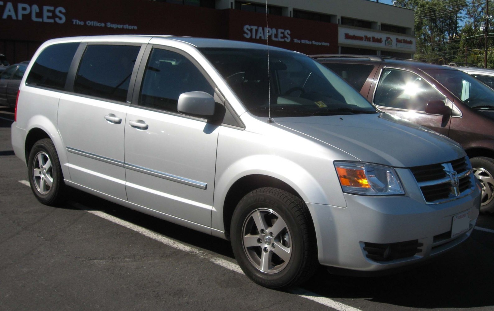 Silver minivan with front side view and alloy wheels