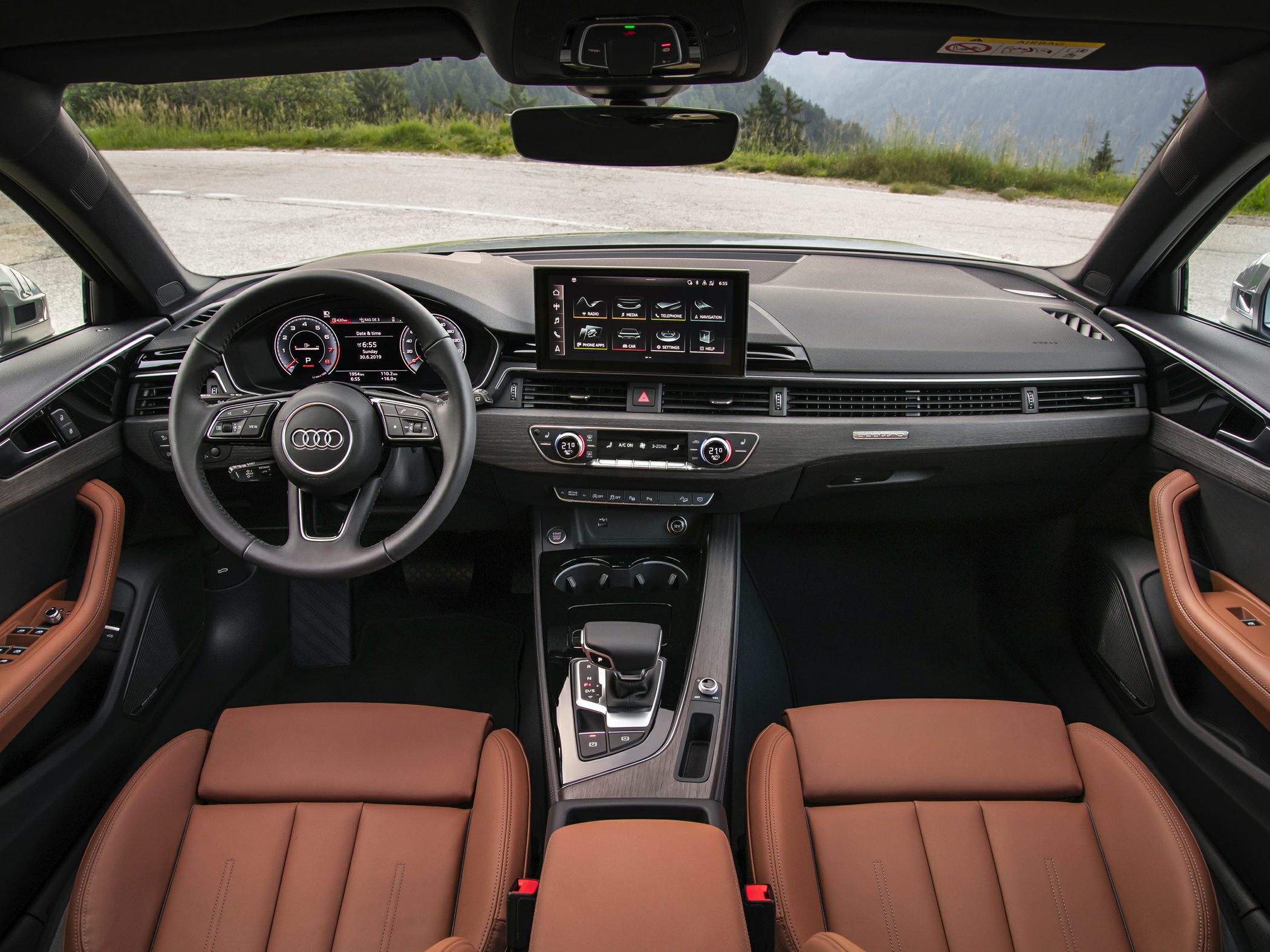 Digital instrument cluster and touchscreen infotainment in modern SUV interior