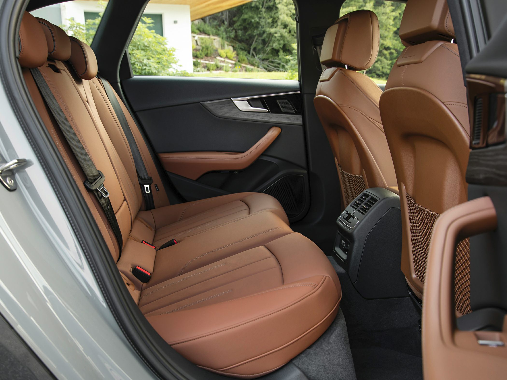 Brown leather rear seats with door trim and rear climate controls