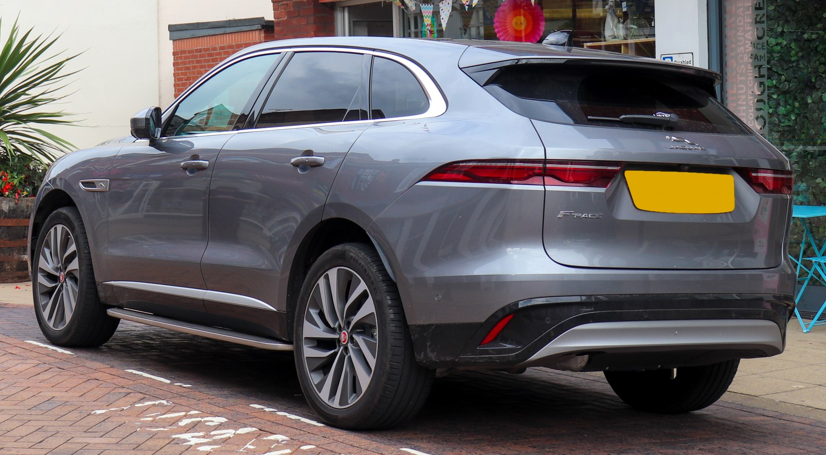 Rear and side view featuring sleek lines and alloy wheels