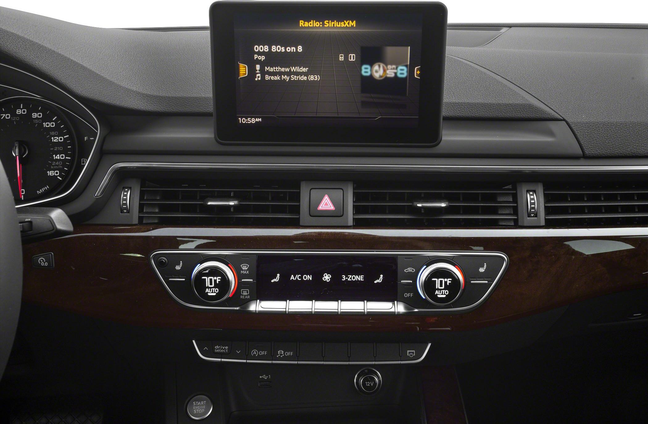 Digital climate control and infotainment display on luxury sedan dashboard
