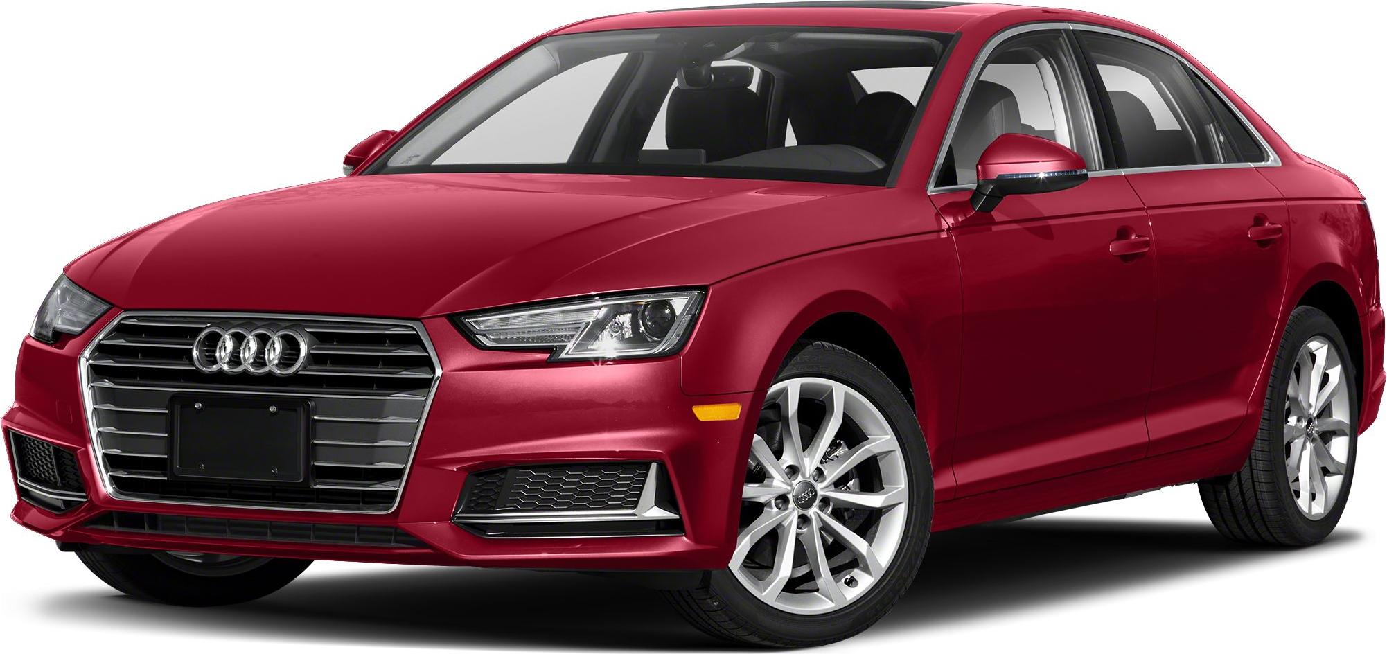 Red sedan with front grille, angular headlights, and alloy wheels.