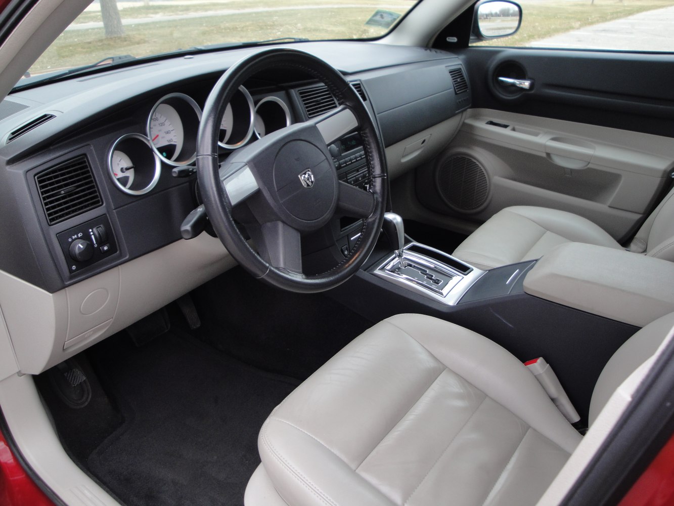 Dashboard and beige leather seats with automatic gear shift