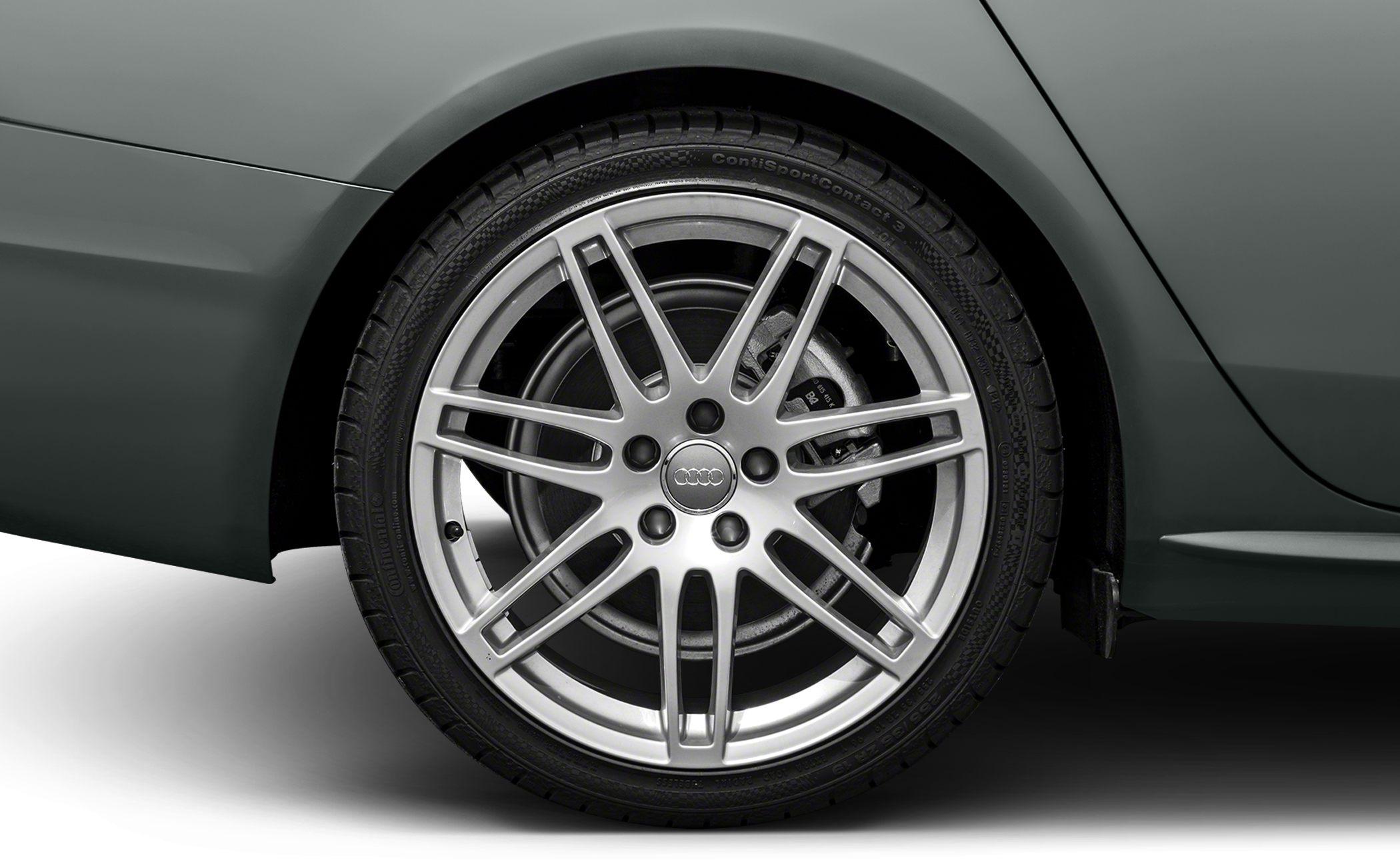 Multi-spoke alloy wheel with tire and brake caliper
