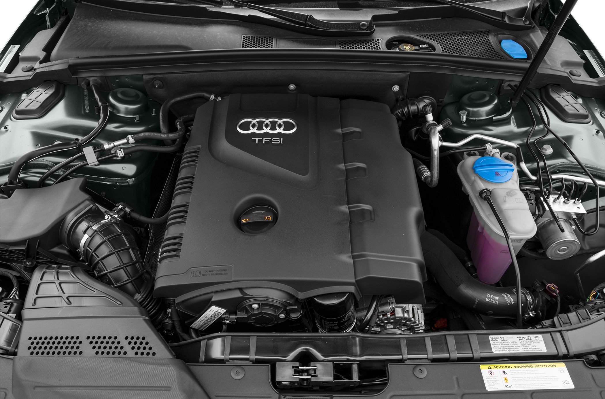 TFSI engine with visible coolant container and structured engine cover