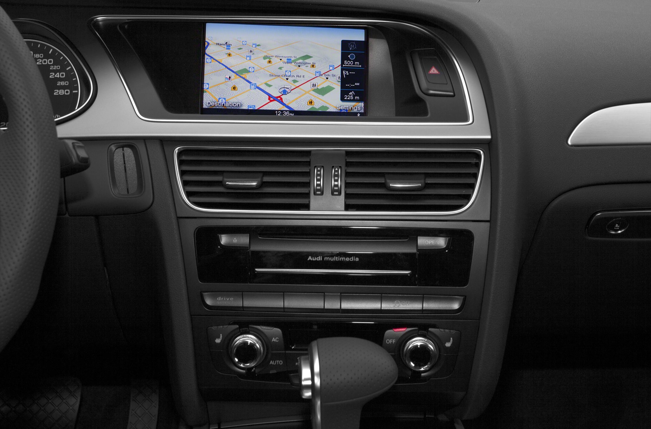 Multimedia navigation screen and climate controls in car interior