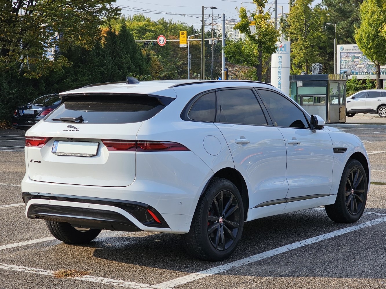 Rear-side view with sleek taillights and black alloy wheels