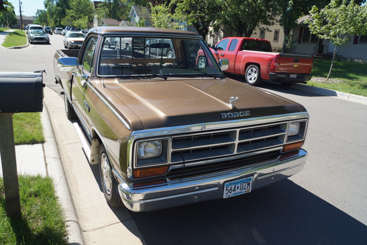 Front view of vintage pickup with distinctive grille and hood ornament
