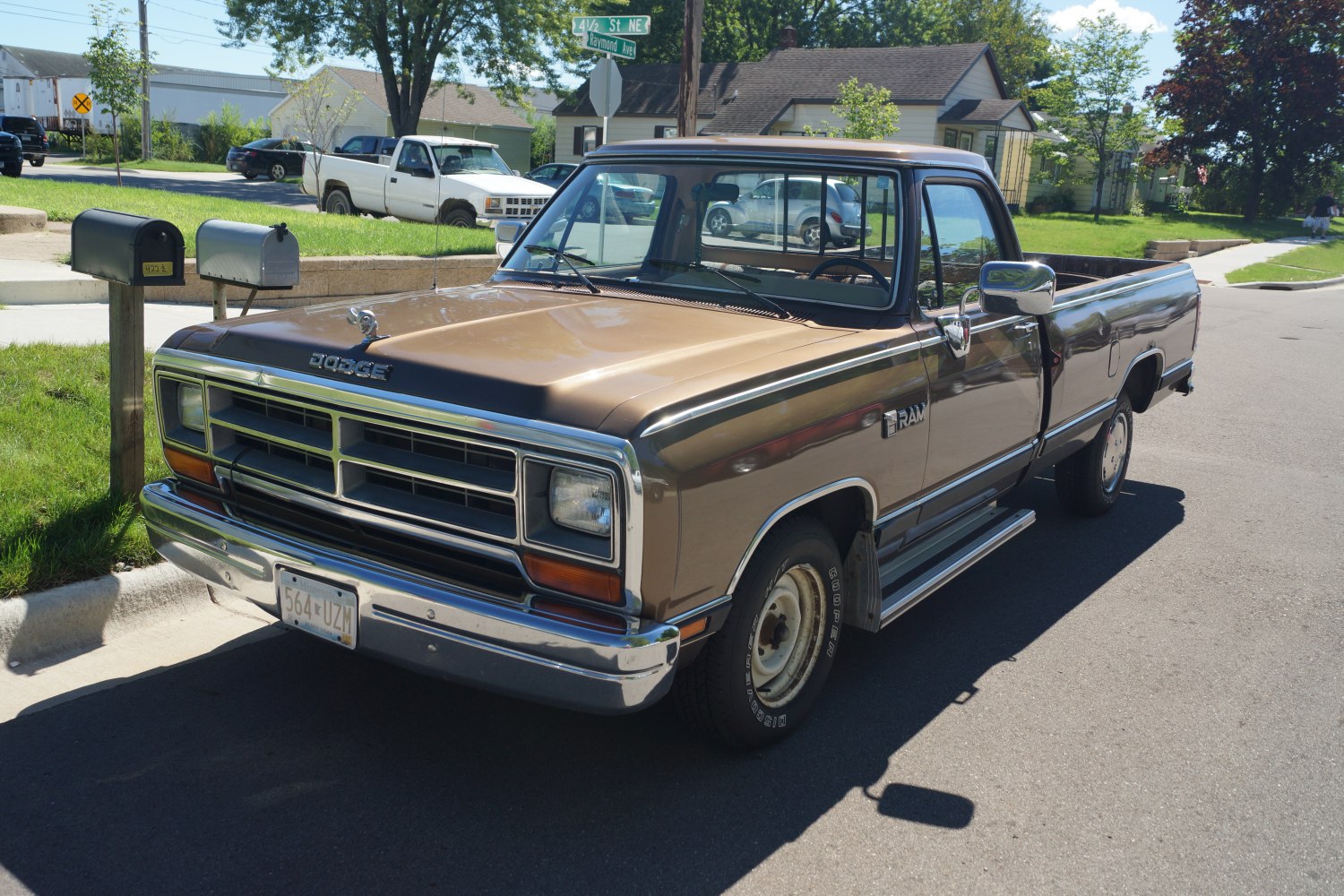 Brown mid-size pickup truck with chrome grille and conventional cab