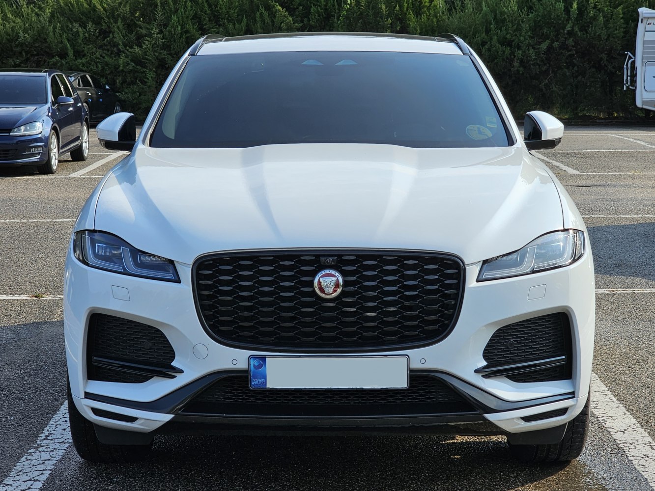Front view of SUV with distinctive grille and LED headlights