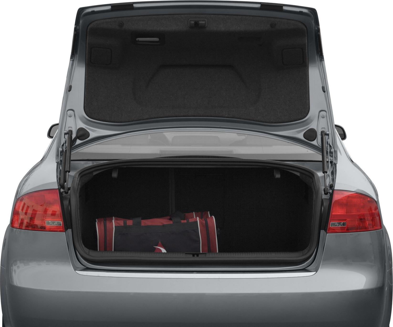 Open trunk with a red and black bag inside.