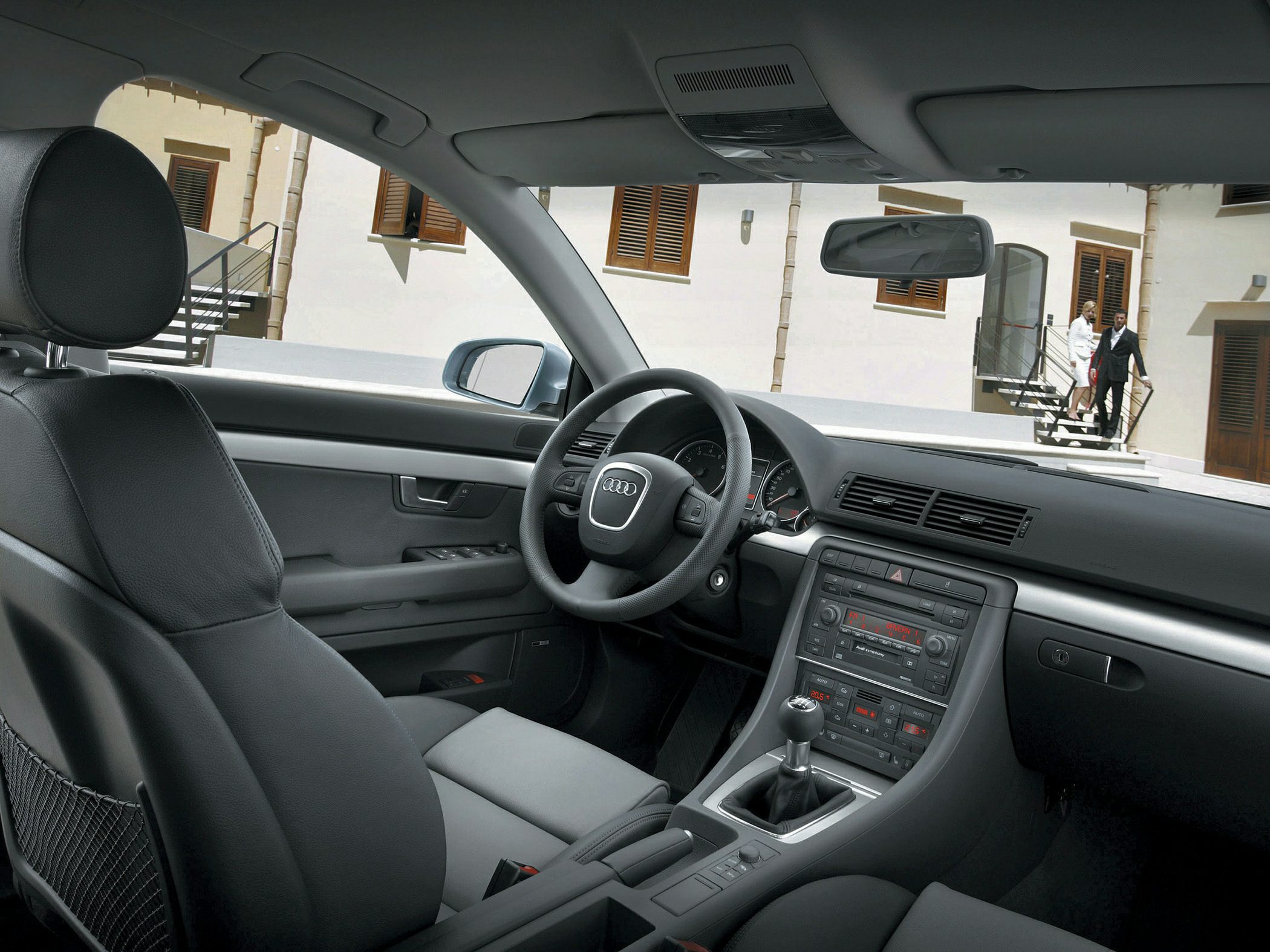 Manual transmission interior with steering wheel and dashboard