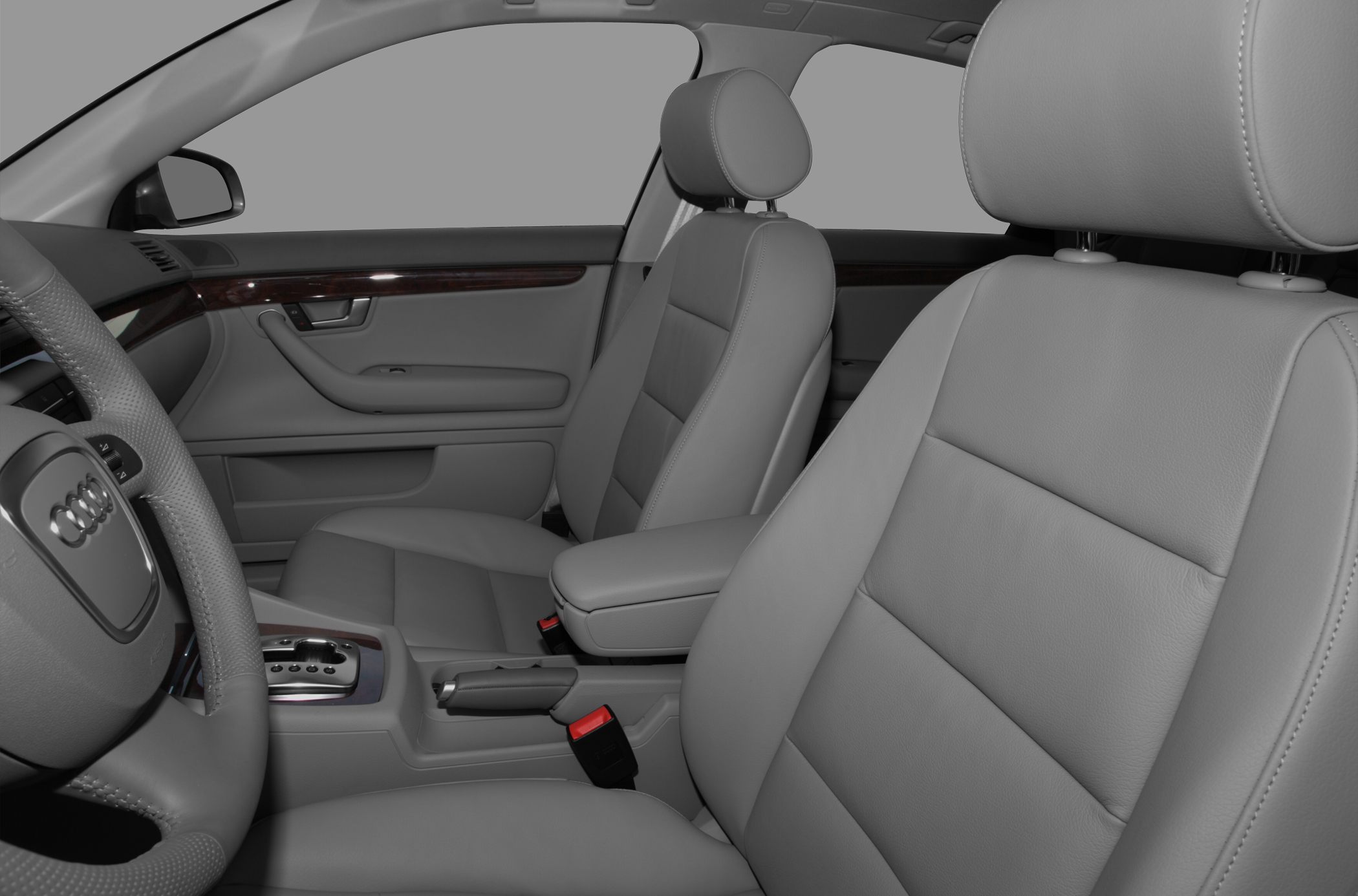 Gray leather front seats and dashboard with steering wheel and console