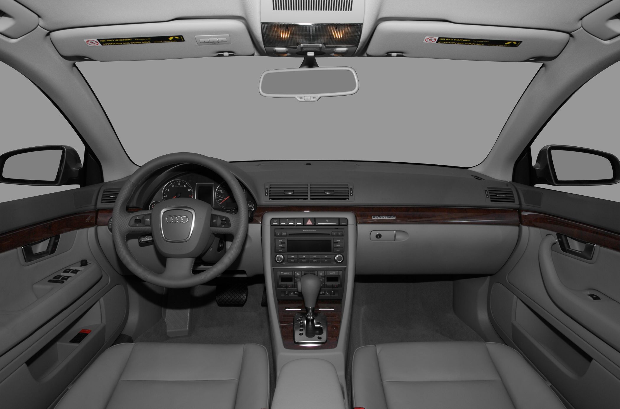 Dashboard and steering wheel with wood trim and control panel