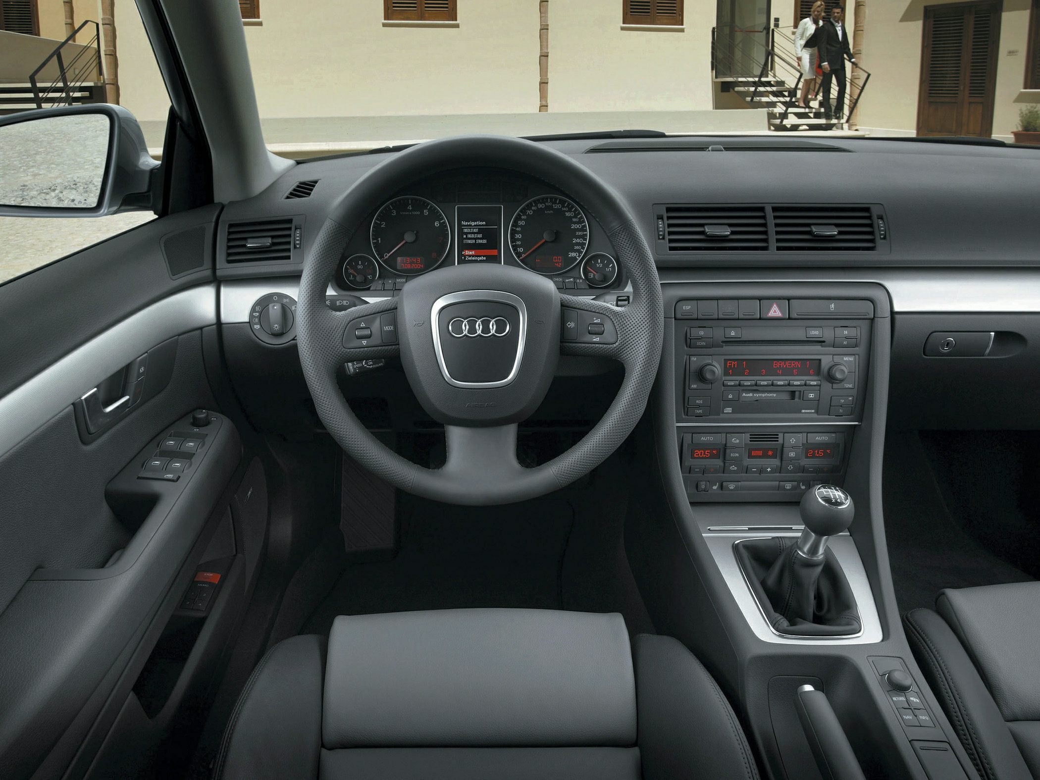 Steering wheel, manual gear shifter, and dashboard interior view