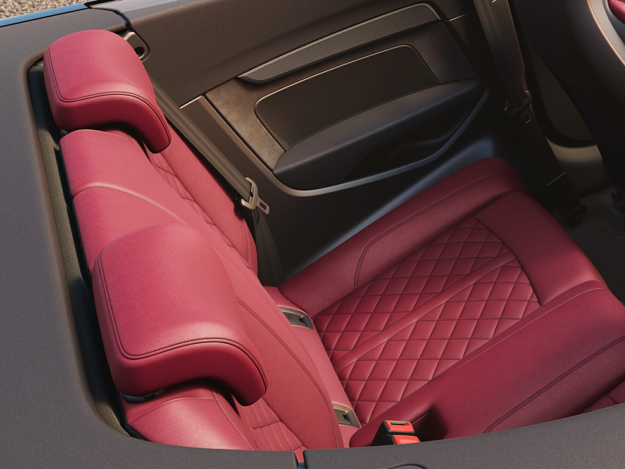 Premium quilted red leather rear seats with seat belts inside a convertible