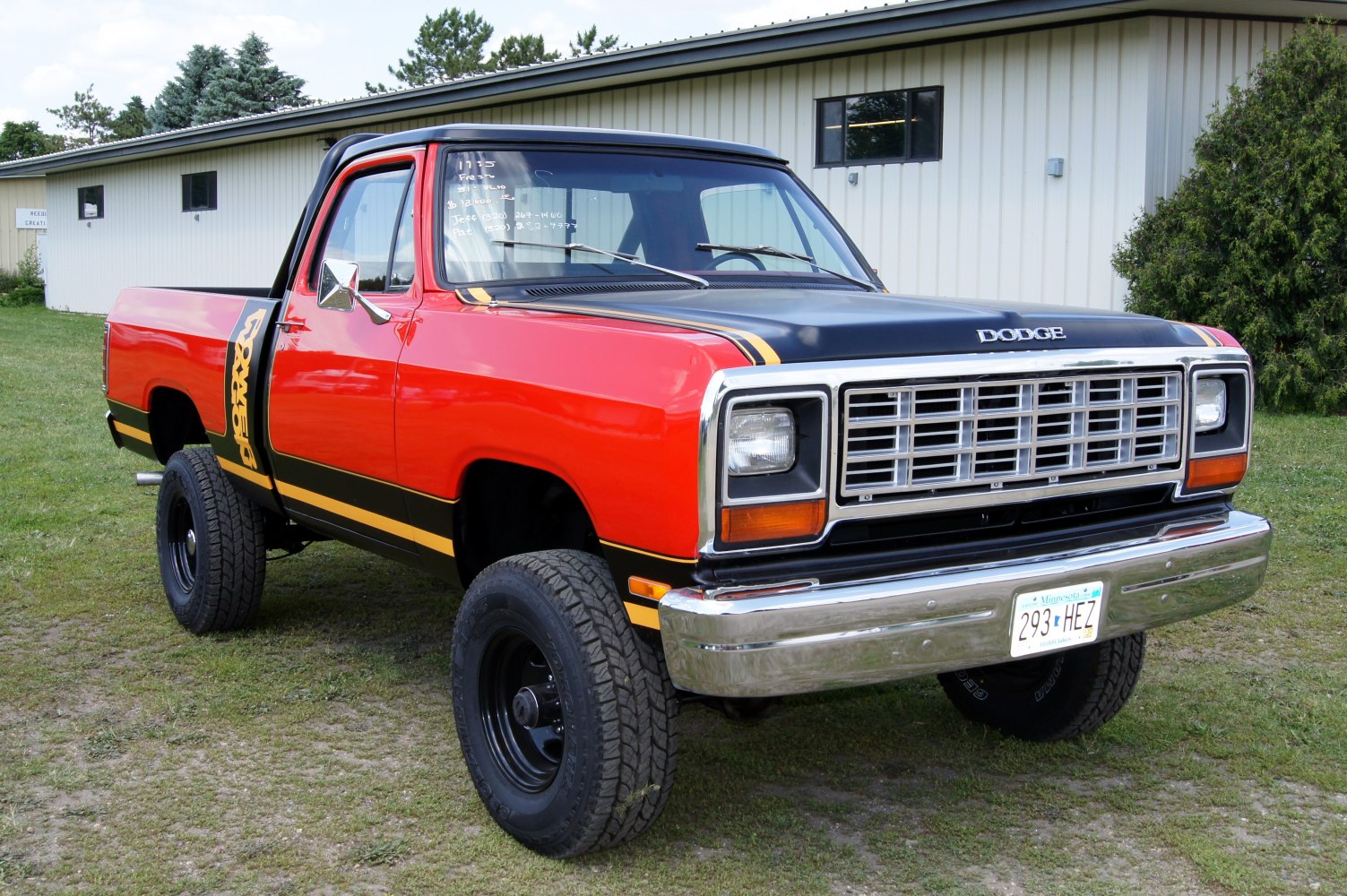 Pickup truck with conventional cab, short bed, two-tone paint, and vintage front grille.