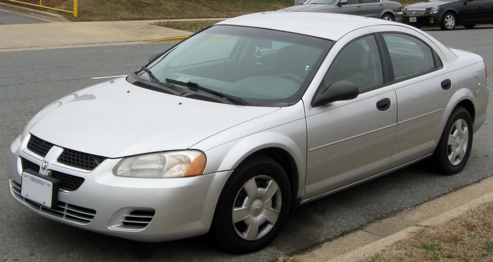 Silver mid-size sedan with distinctive front grille and alloy wheels