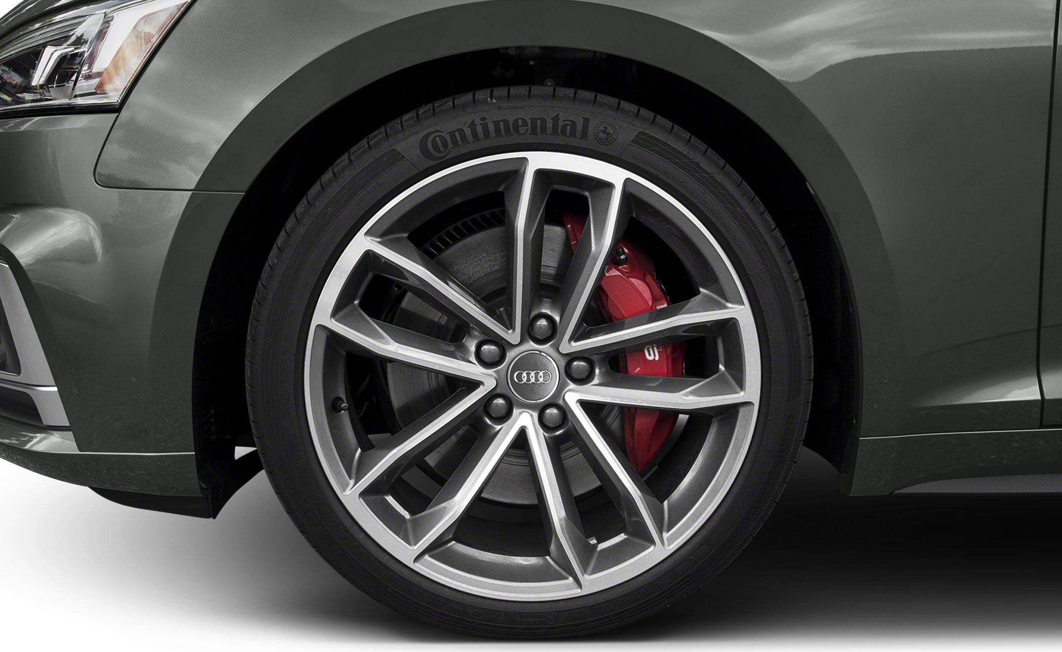 Close-up of alloy wheel with red brake caliper