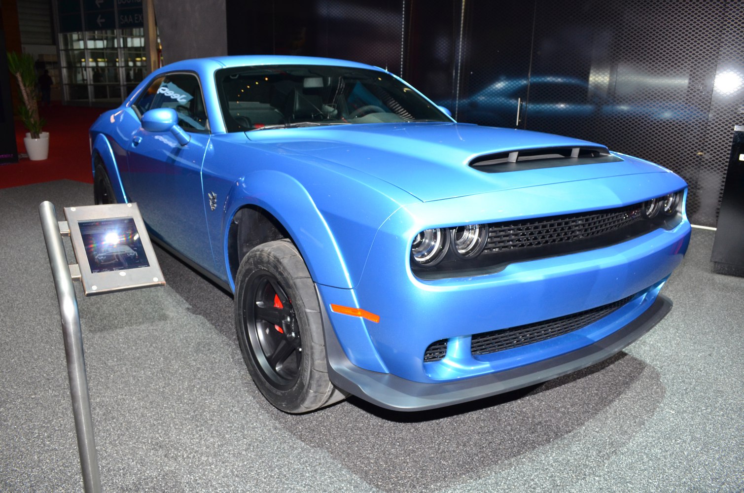 Blue muscle coupe with hood scoop and wide fenders