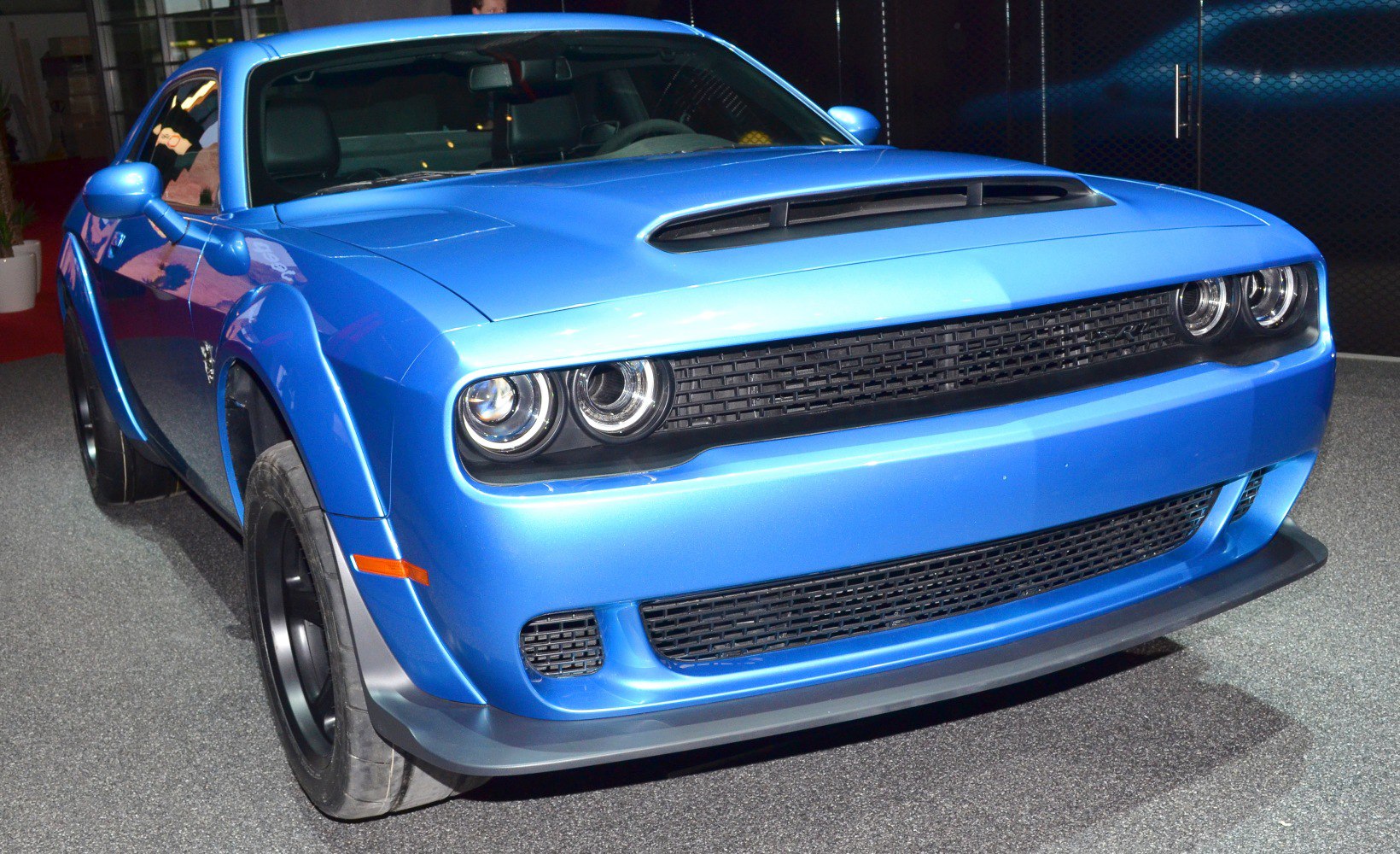 Aggressive muscle car front with hood scoop and dual round LED headlights