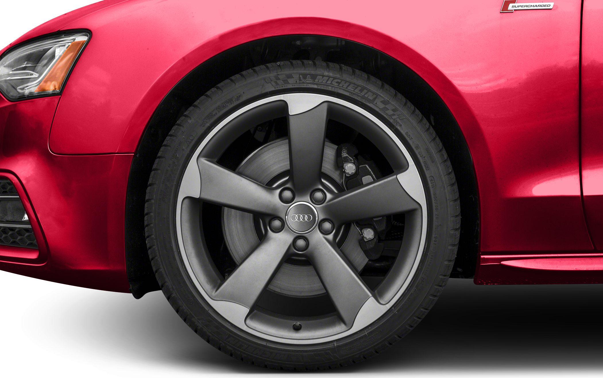 5-spoke alloy wheel with brake disc and red car body