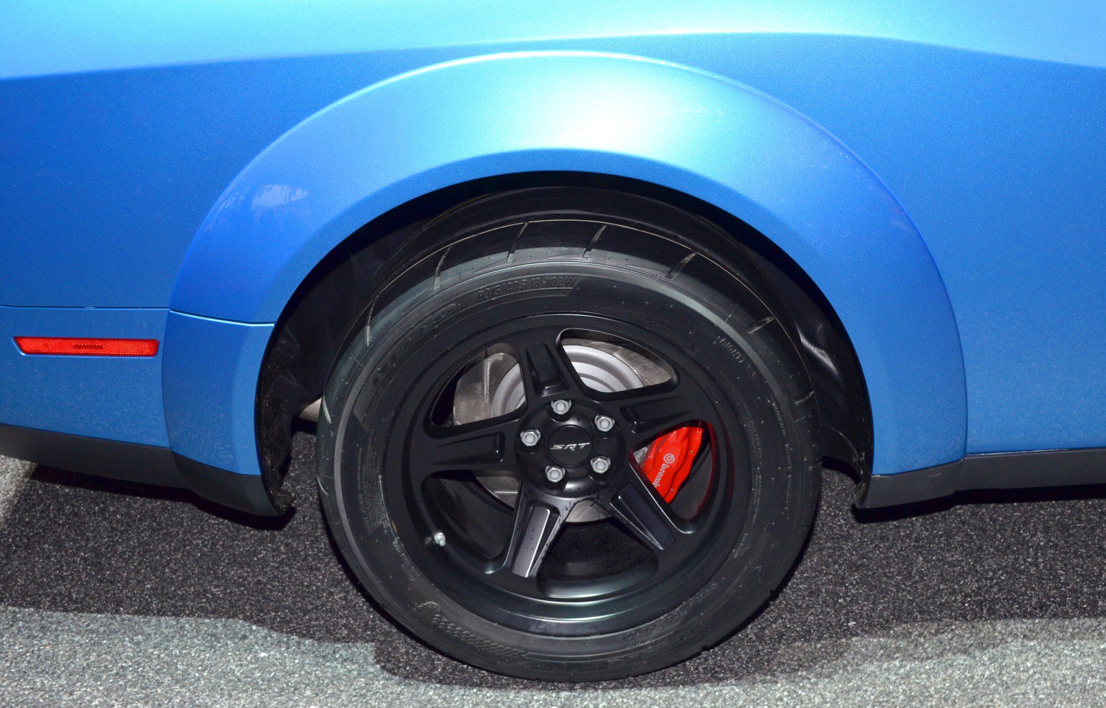 Black SRT alloy wheel and red Brembo brake caliper