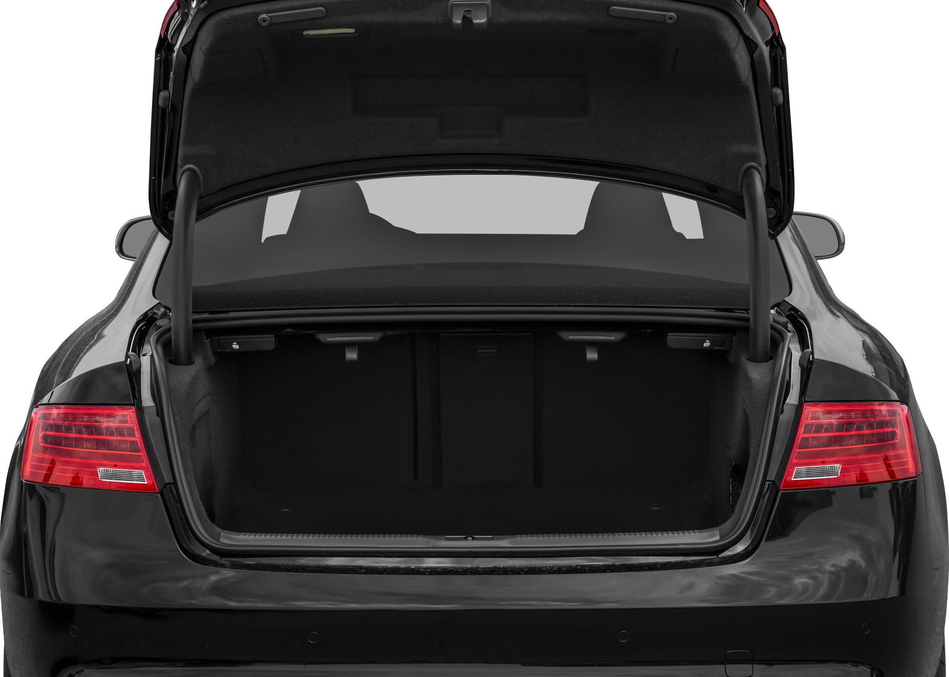 Open trunk view of a luxury coupe rear with taillights visible