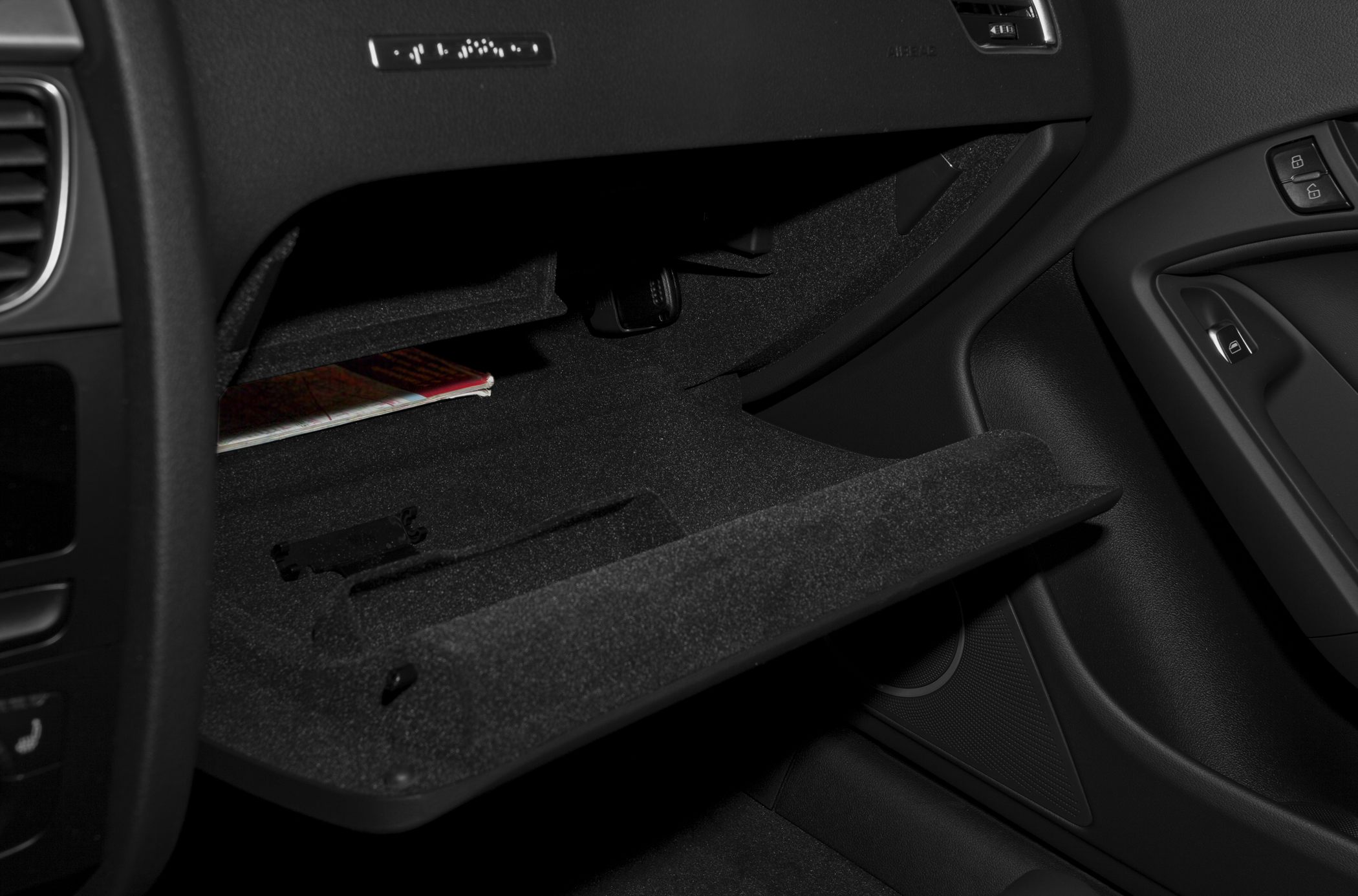 Soft-lined glovebox compartment with dashboard materials and controls