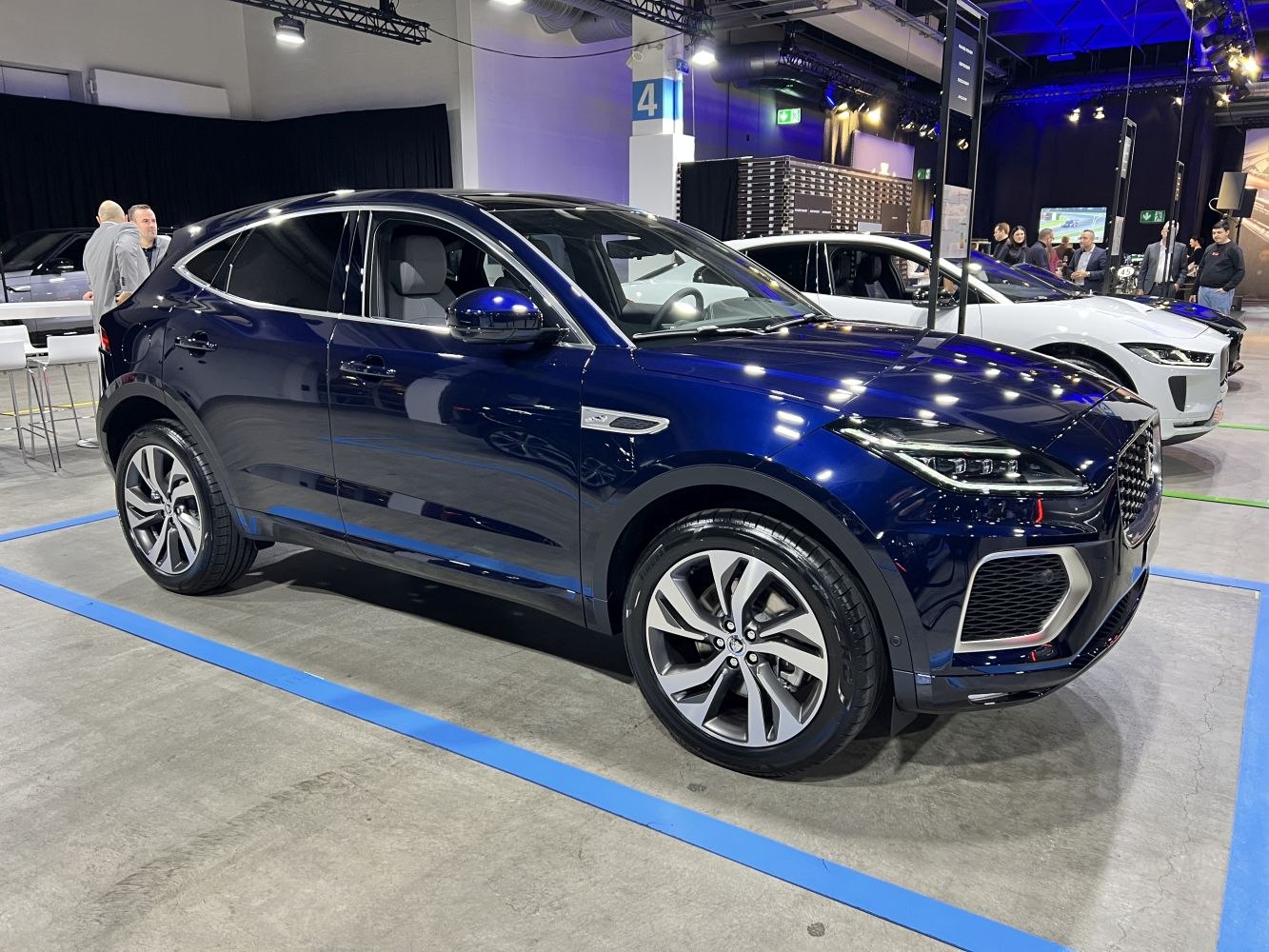 Front side view of mid-size SUV with visible interior and modern styling