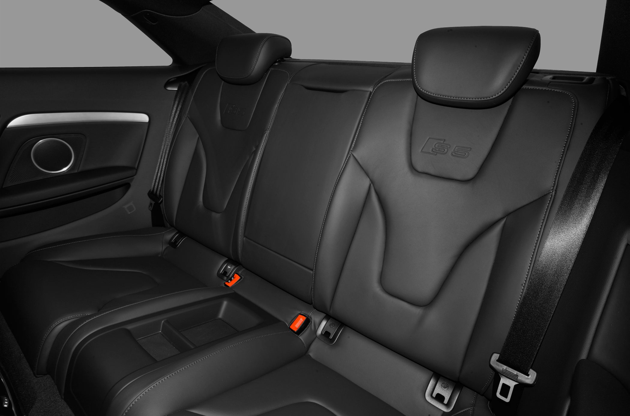 Luxurious rear black leather seats with S5 embossed design and integrated headrests.