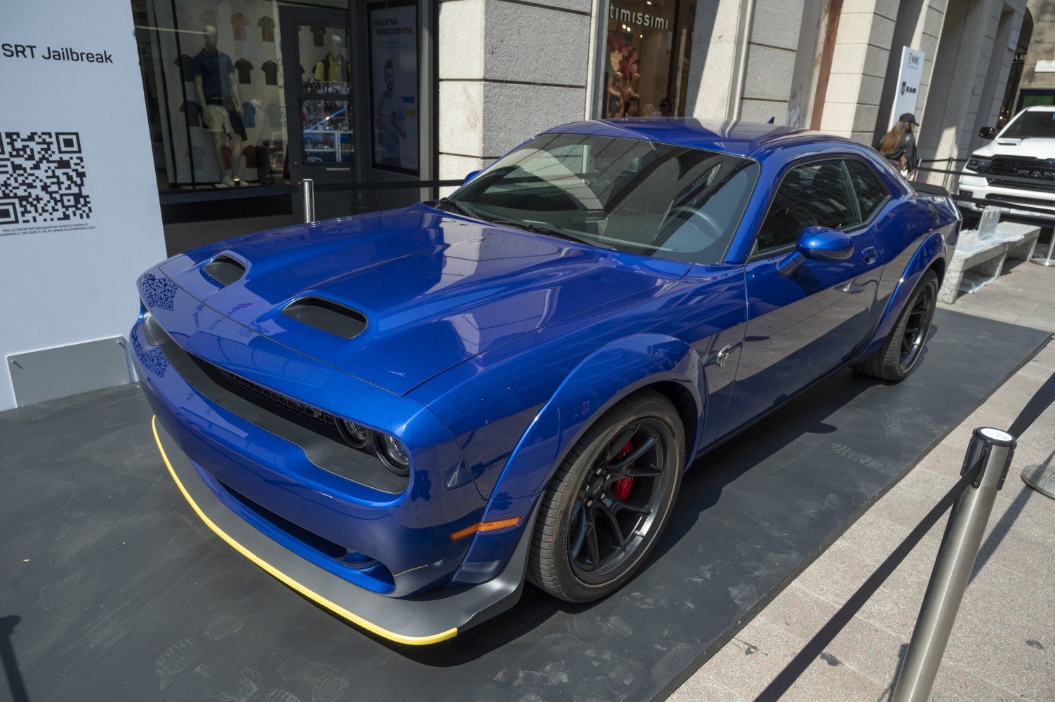 Widebody muscle car with hood scoops and black alloy wheels
