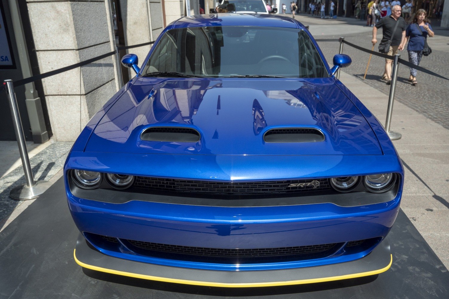 Aggressive front fascia with dual hood scoops and iconic quad headlights